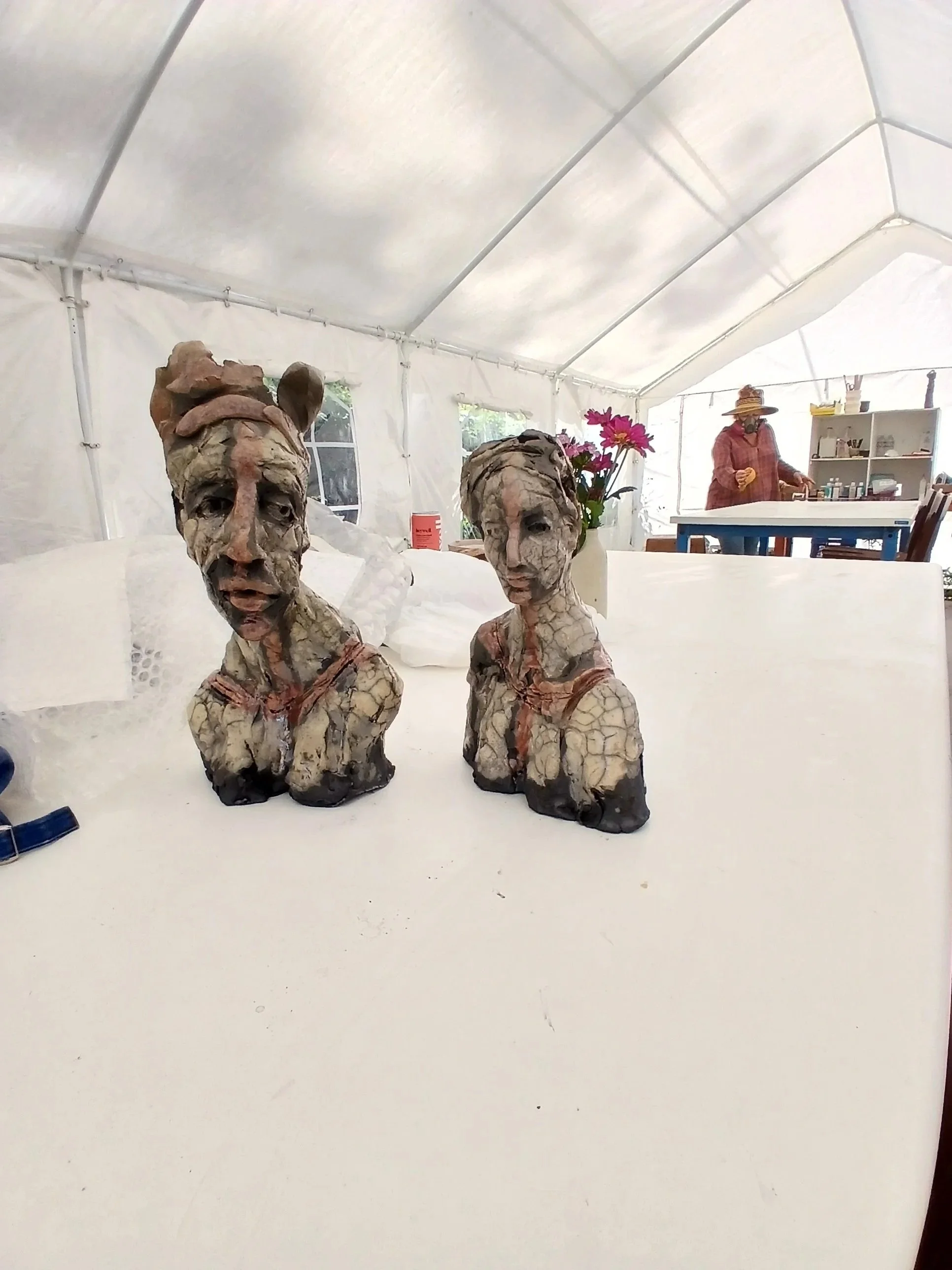 Raku Couple "Who Wears the Crown" about dynamics in relationships. SOLD at SFWA Gallery.