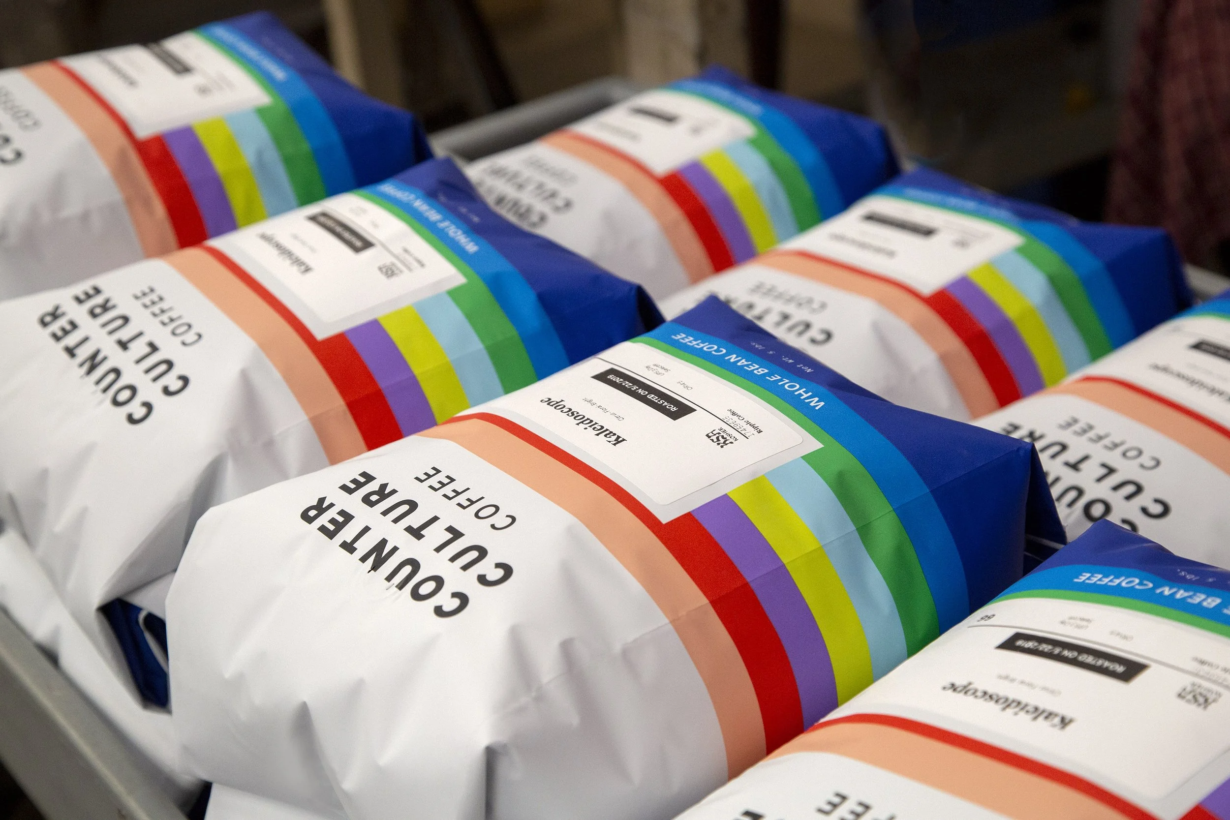 Counter Culture Coffee bulk packaging multicolor stripe design — 5lb whole bean coffee bags on production line