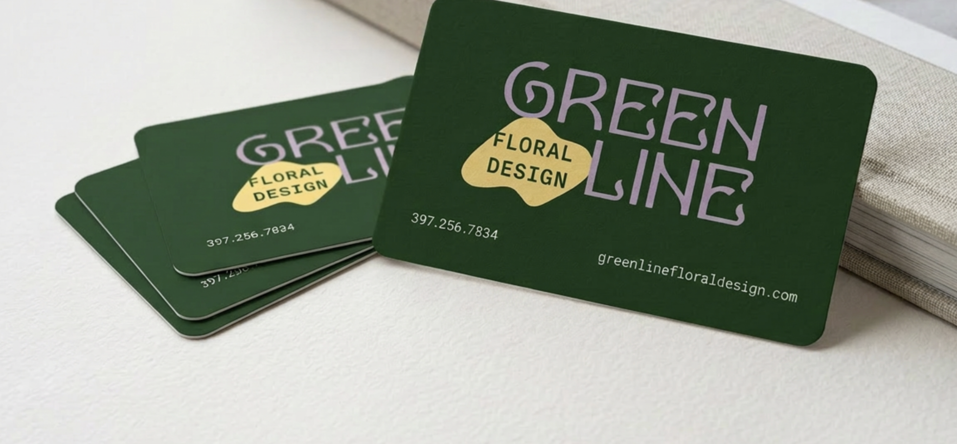 Green Line Floral Design business cards — dark green cards with custom wordmark and contact information