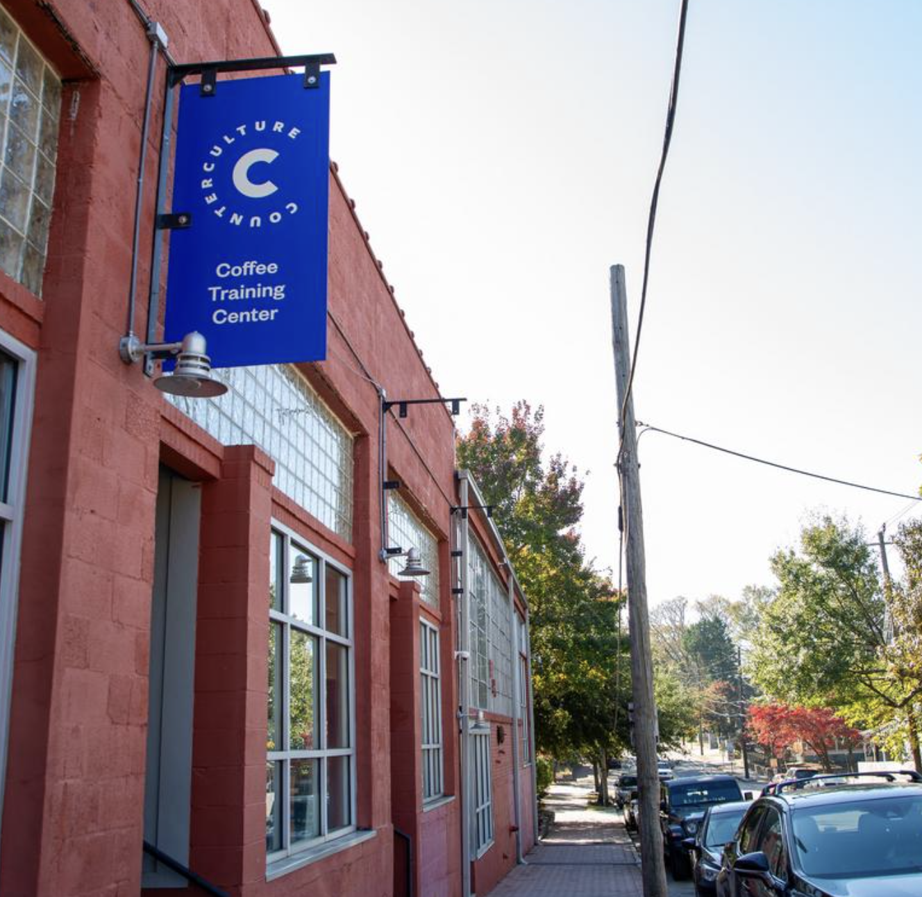 Counter Culture Coffee Atlanta Training Center exterior — red brick building with blue Counter Culture signage