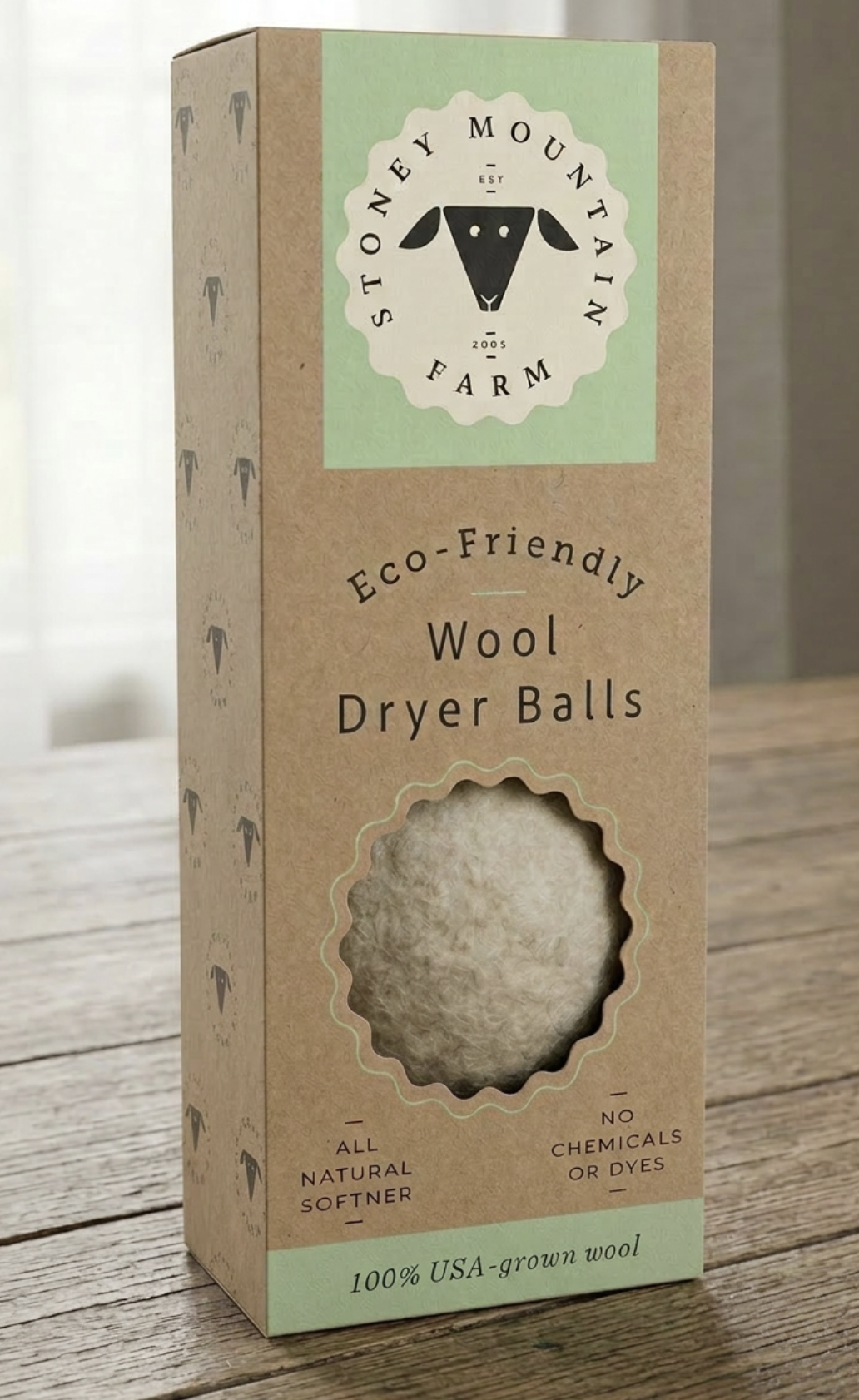 Stoney Mountain Farm eco-friendly wool dryer balls product packaging — kraft box with sage green label and die-cut window