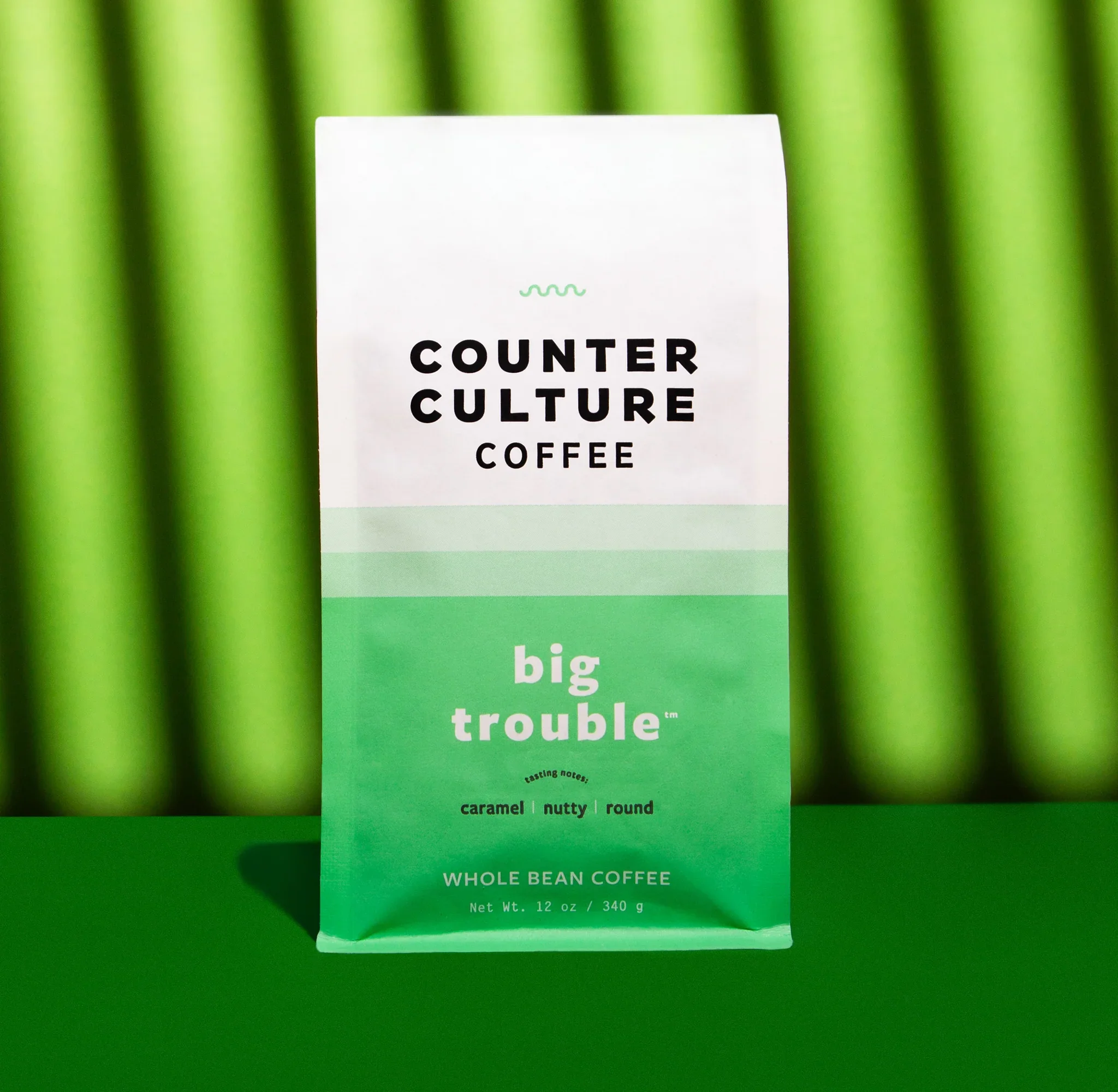 Counter Culture Coffee Big Trouble blend packaging — green gradient whole bean coffee bag