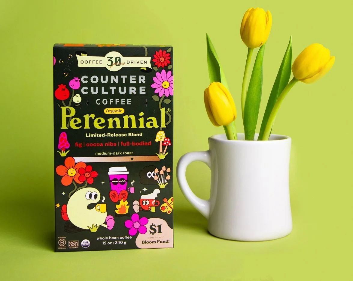 Counter Culture Coffee Perennial seasonal release box — dark green illustrated packaging with tulips and white mug