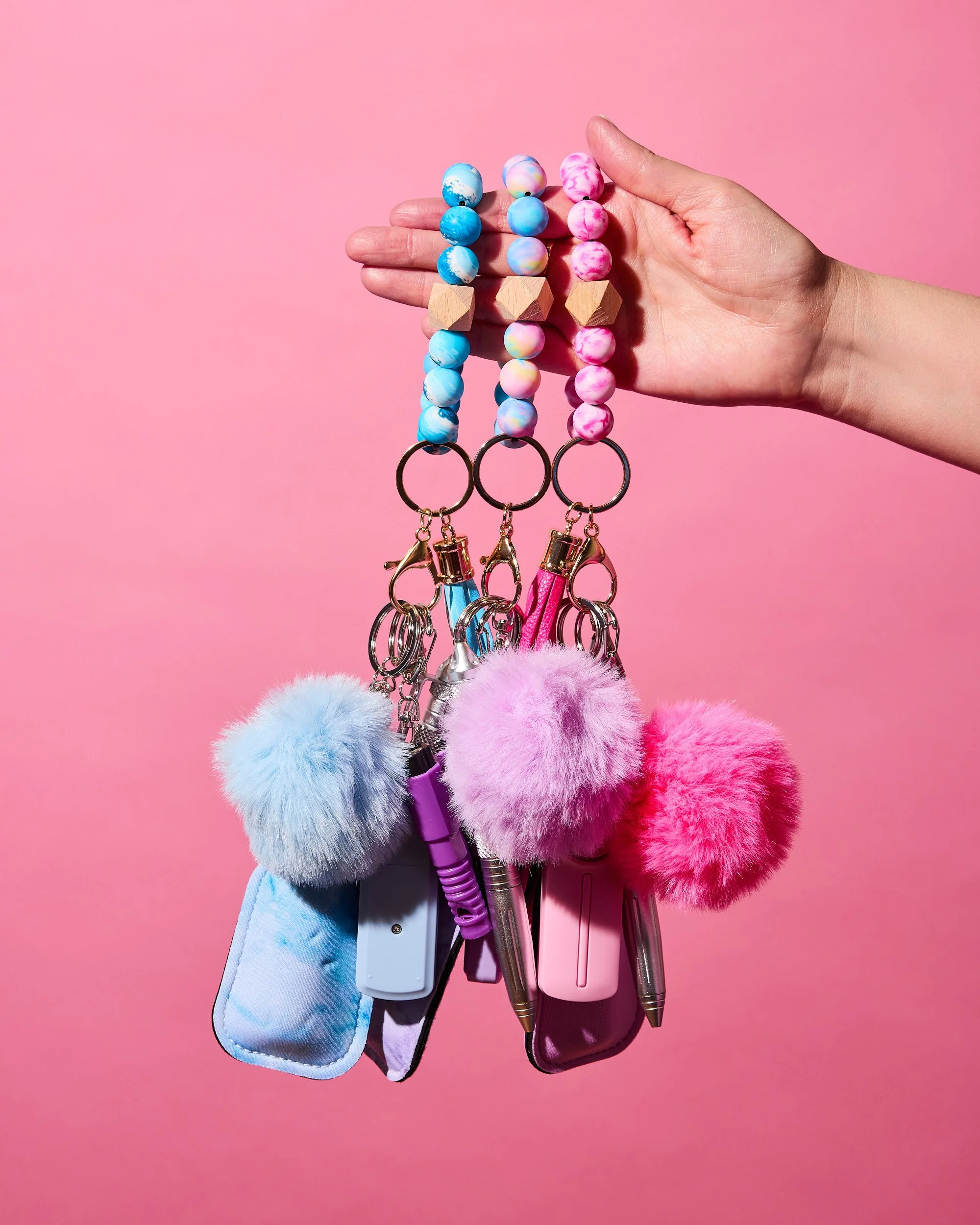 Holding 3 keychains.jpg