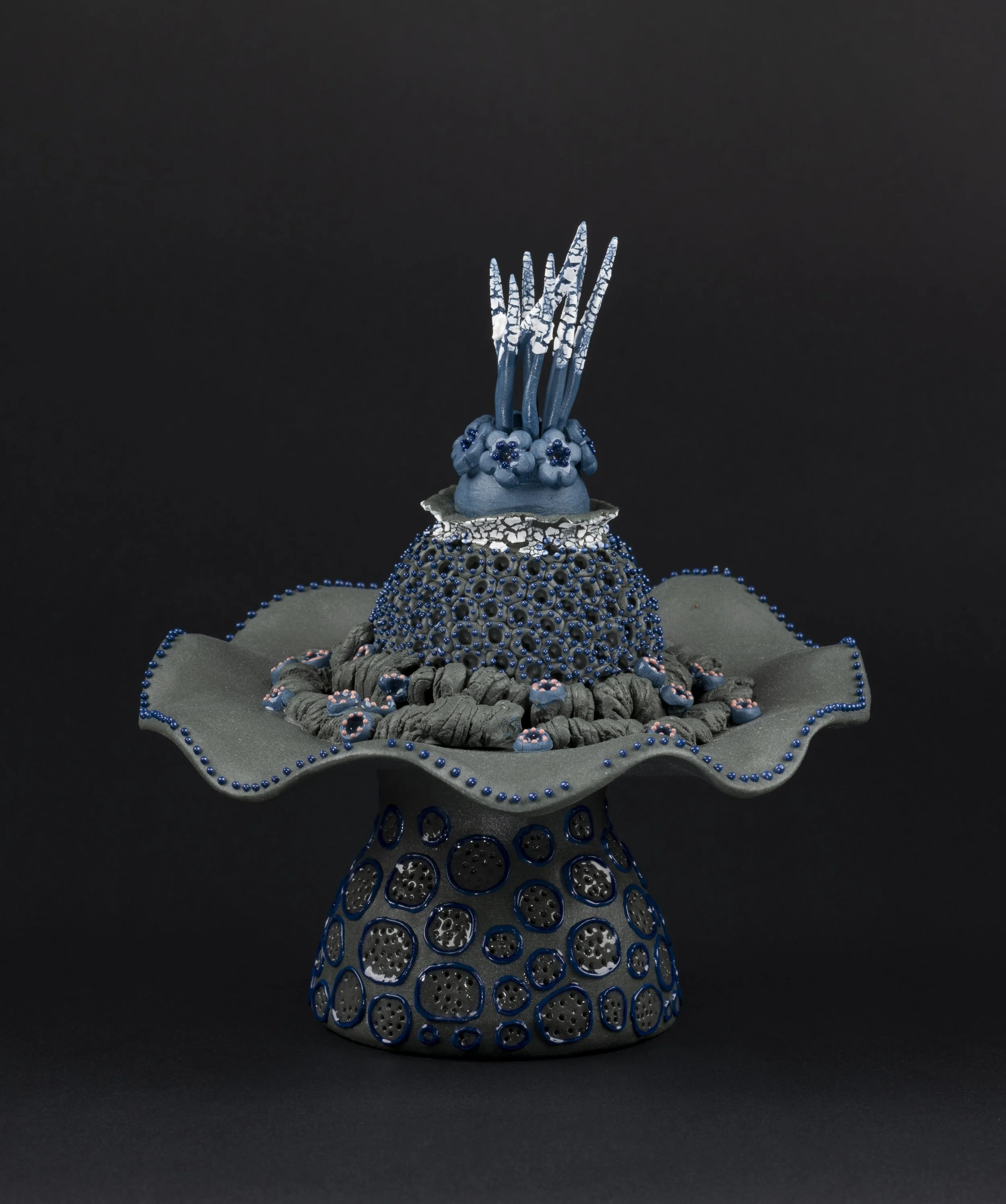 Picture of a unique black blue and white abstract procelain sculpture