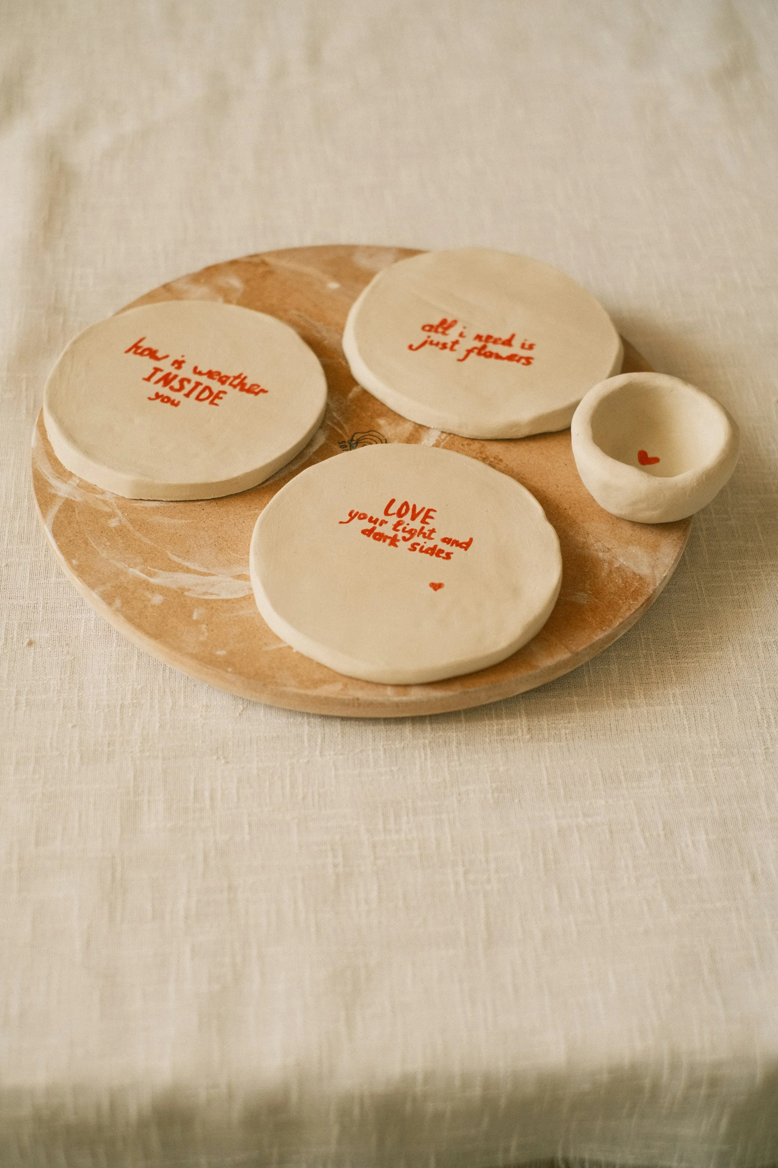 Colourful handmade ceramic dishes for a Clay Nights pottery workshop in Binalong Bay.