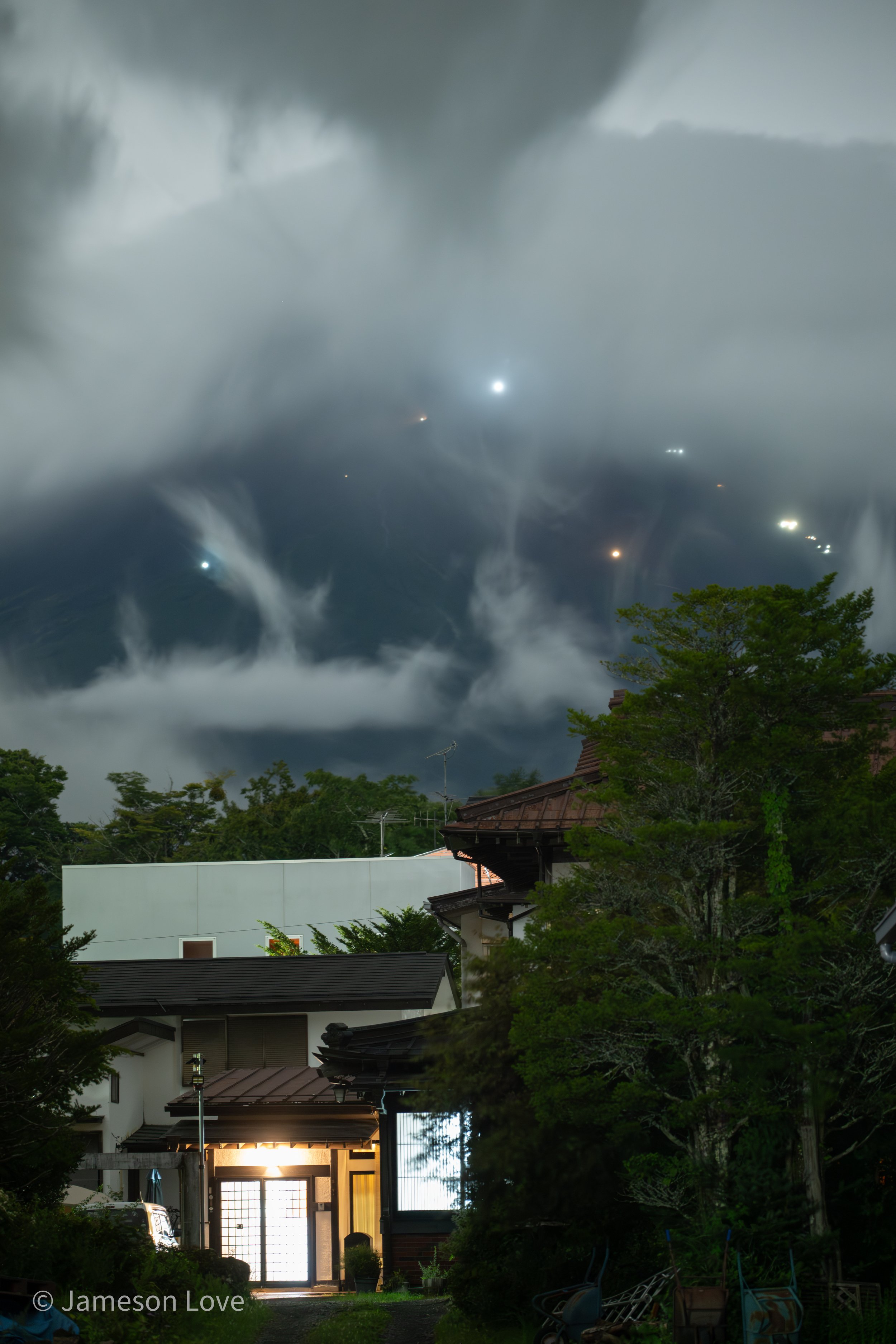 Anticipating Sunrise -- Midnight Pilgrim Lights Climbing Mount Fuji;
Taken from Lake Yamanaka, Japan