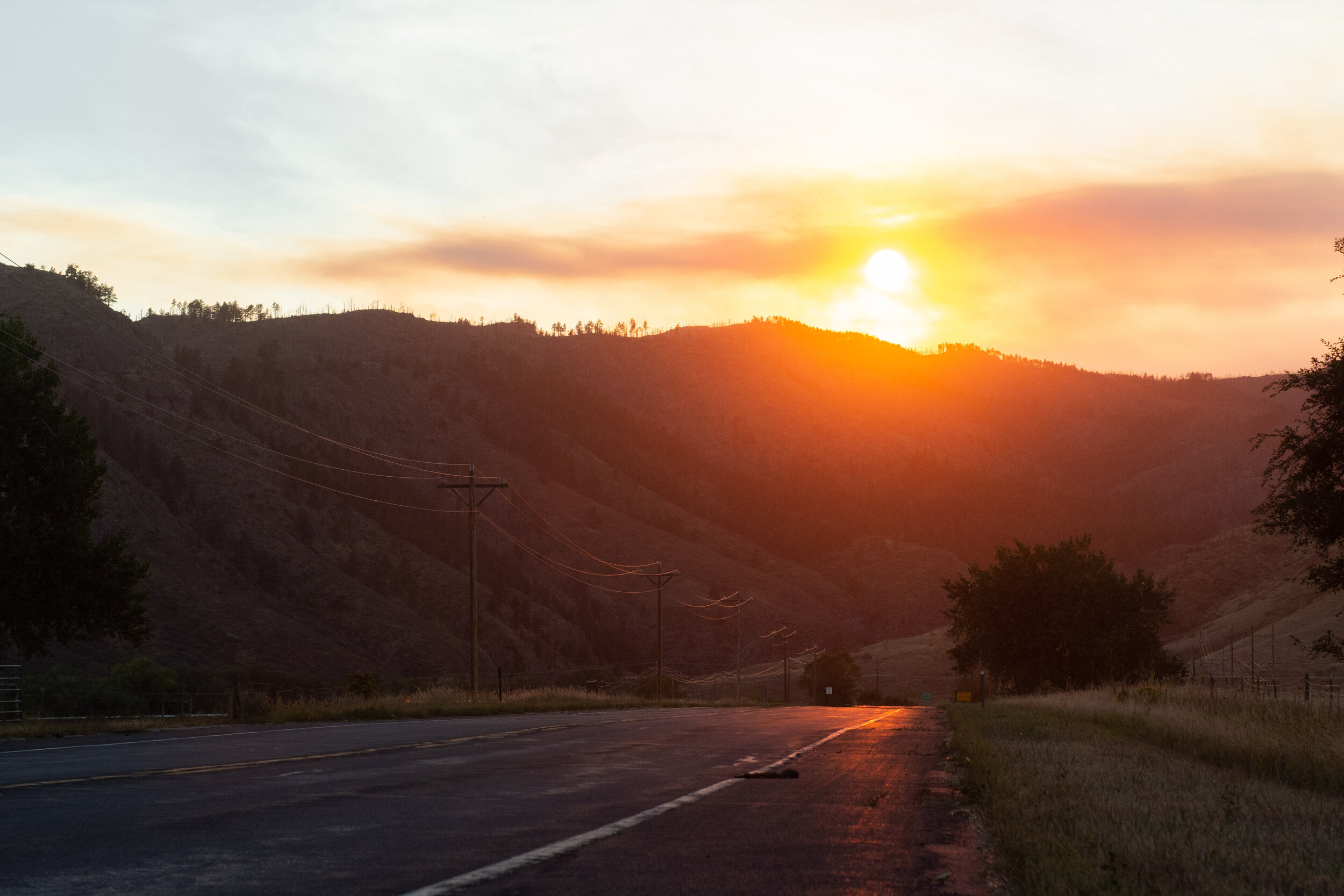 The sun sets through smoke from the Seaman Fire on Sept. 13, 2018. (Colin Shepherd | The Rocky Mountain Collegian)