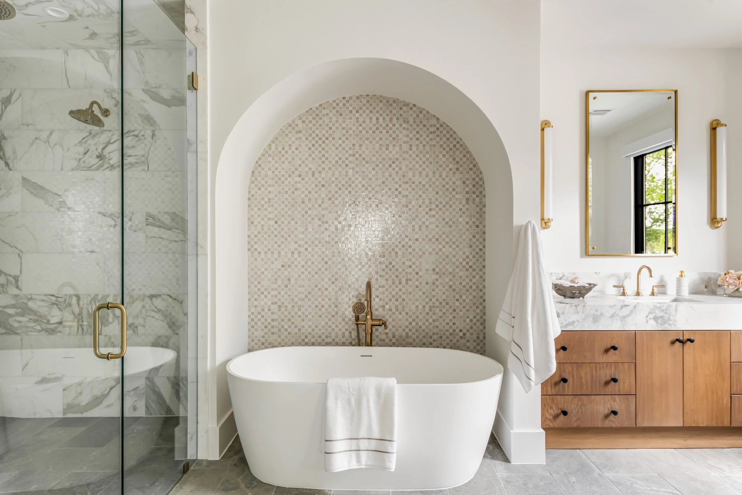 Calacatta marble, warm oak, brushed brass and an arch that makes the whole room feel like a retreat

#stainbackconstruction #explore #bathroomgoals #luxuryhomes