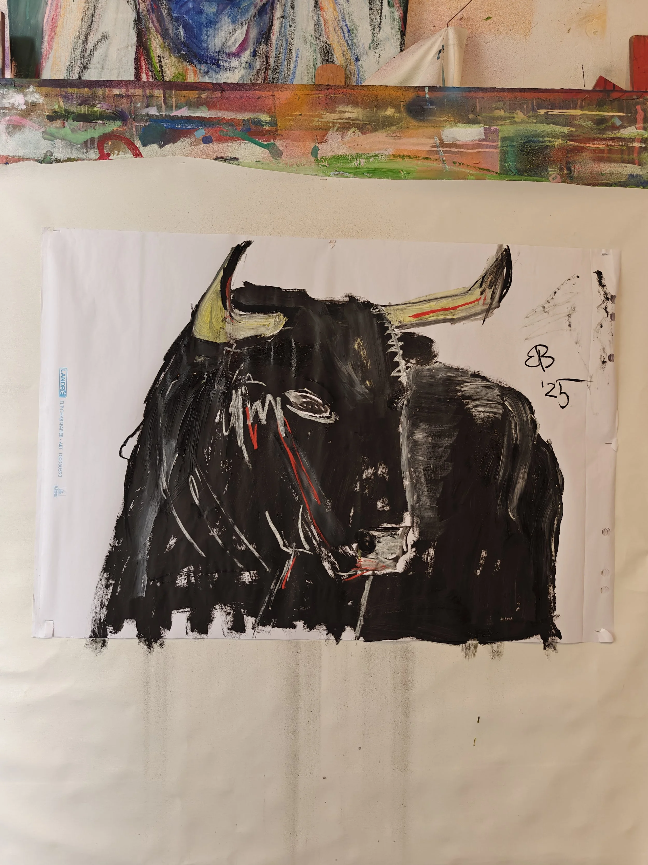 Abstract painting of a black cow with horns, featuring red and beige accents, signed 'EB 25' in the top right corner.