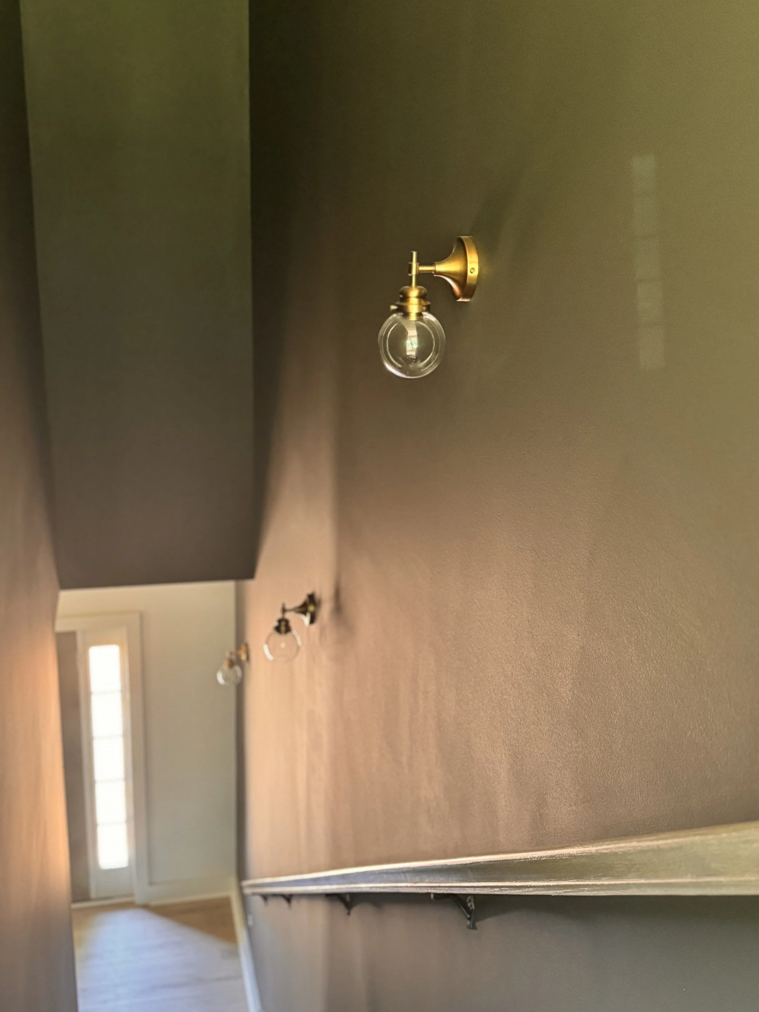 Check out that deep stairwell, color drenched in Urbane Bronze!