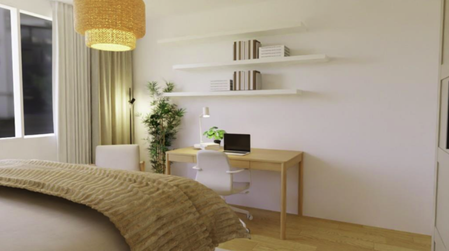 Modern bedroom with a workspace featuring a wooden desk, white chair, potted plant, and shelves with books, near a window with curtains and a hanging light fixture.