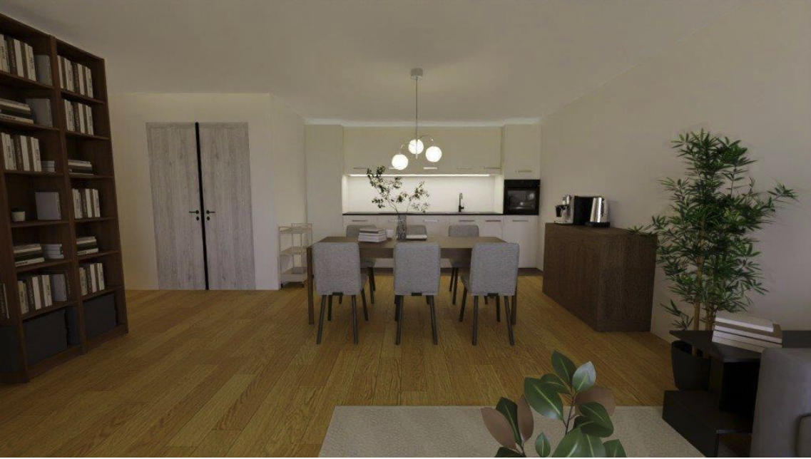 Open-concept dining area and kitchen with wooden flooring, a dining table with six chairs, a bookshelf on the left, a kitchen counter with hanging lights, and minimal decor including a large potted plant.