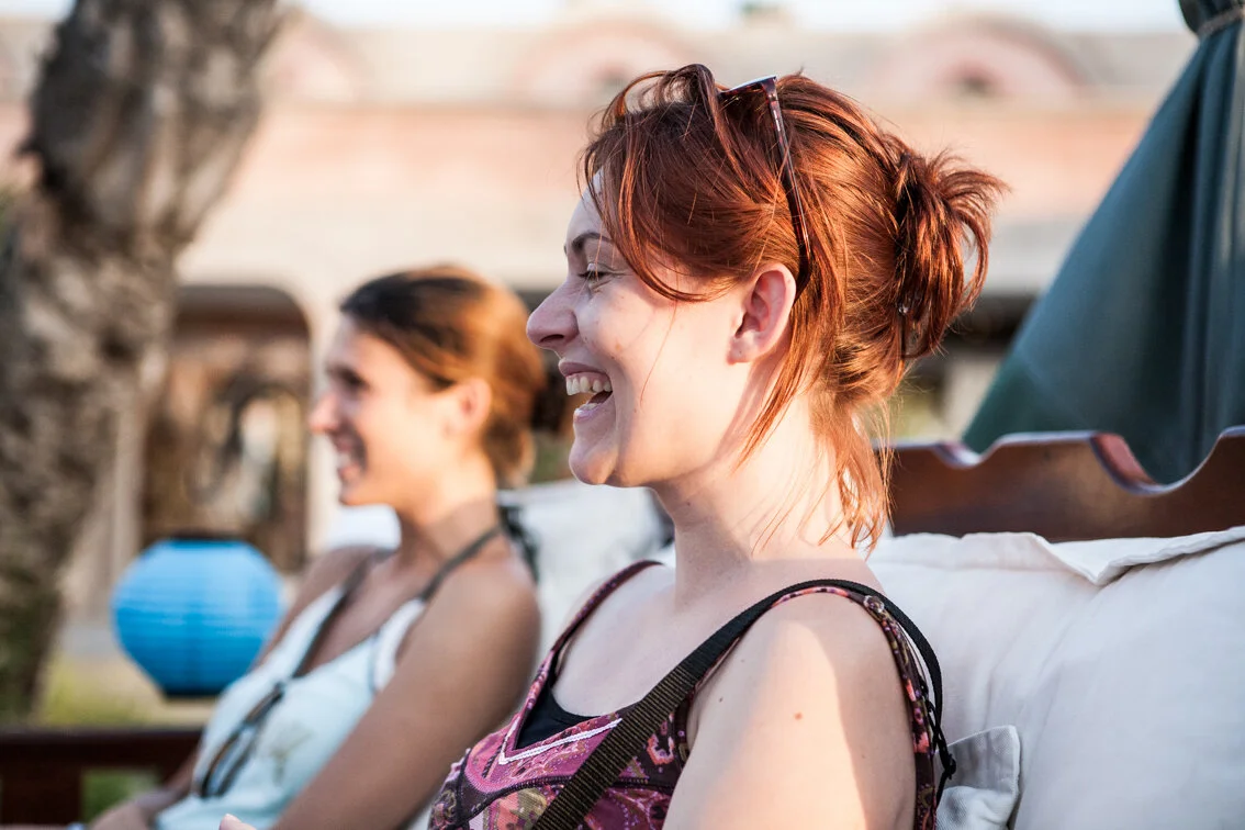A girl sitting and smiling