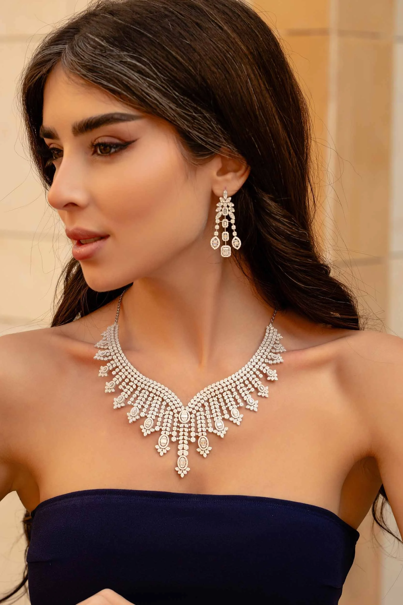 Luxury diamond necklace and earrings showcased on female model in Dubai