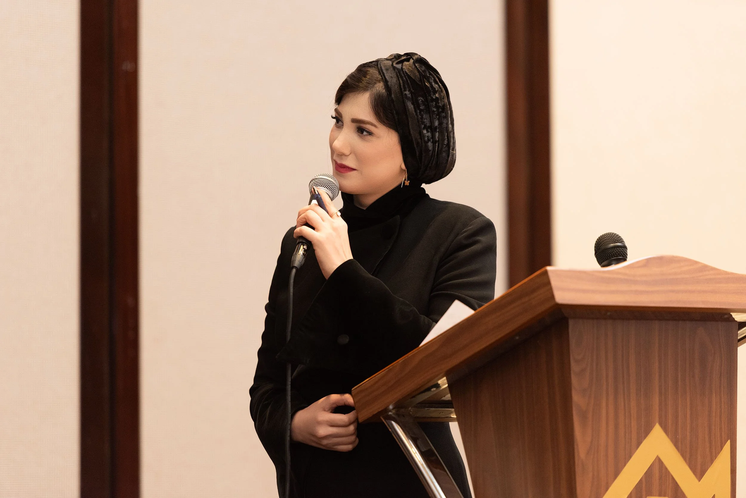 Guest speaker addressing attendees during the Al Madaen Persian Restaurant grand opening event in Dubai.