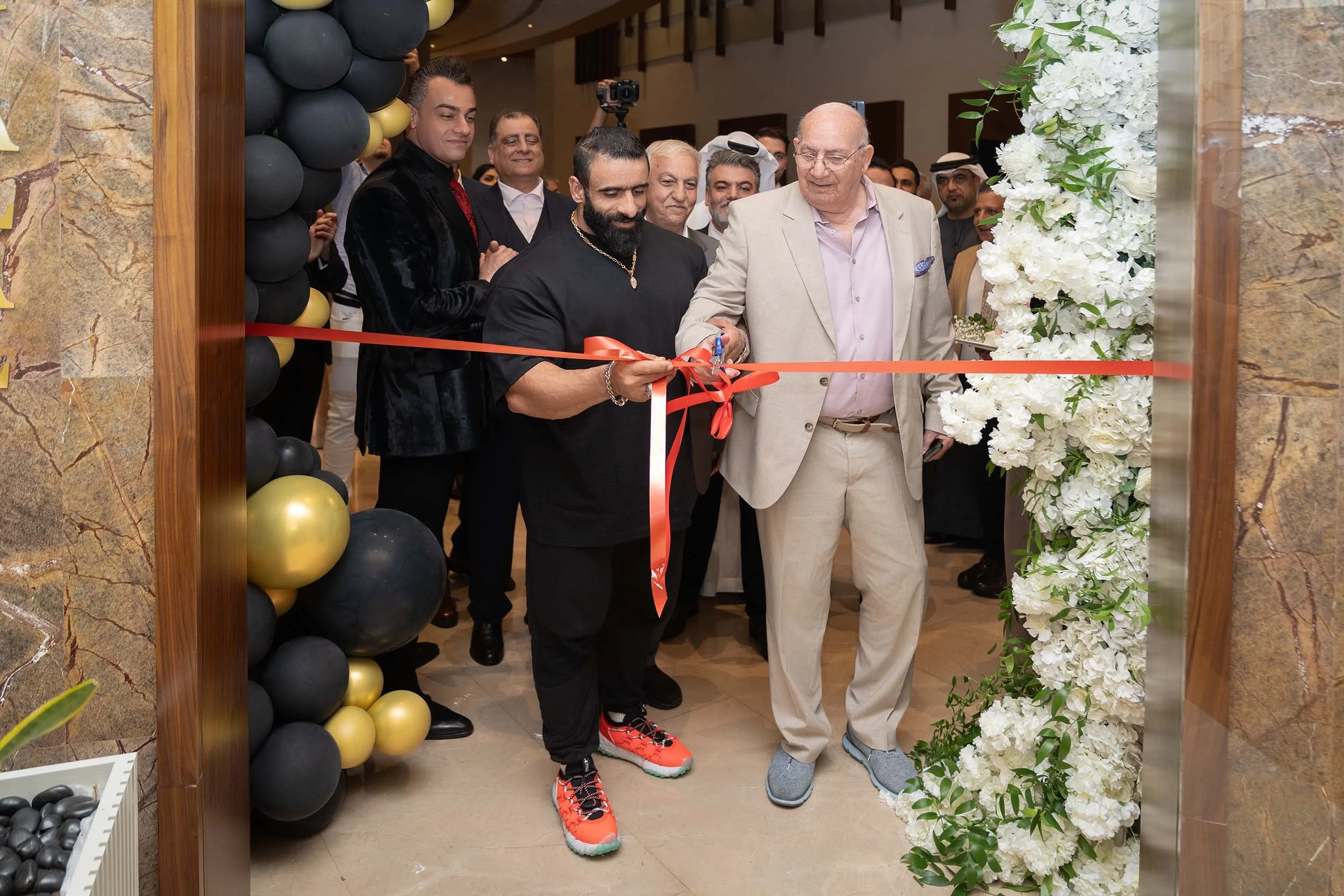 Grand opening ribbon-cutting ceremony at Al Madaen Persian Restaurant in Dubai, professionally photographed during the launch event.