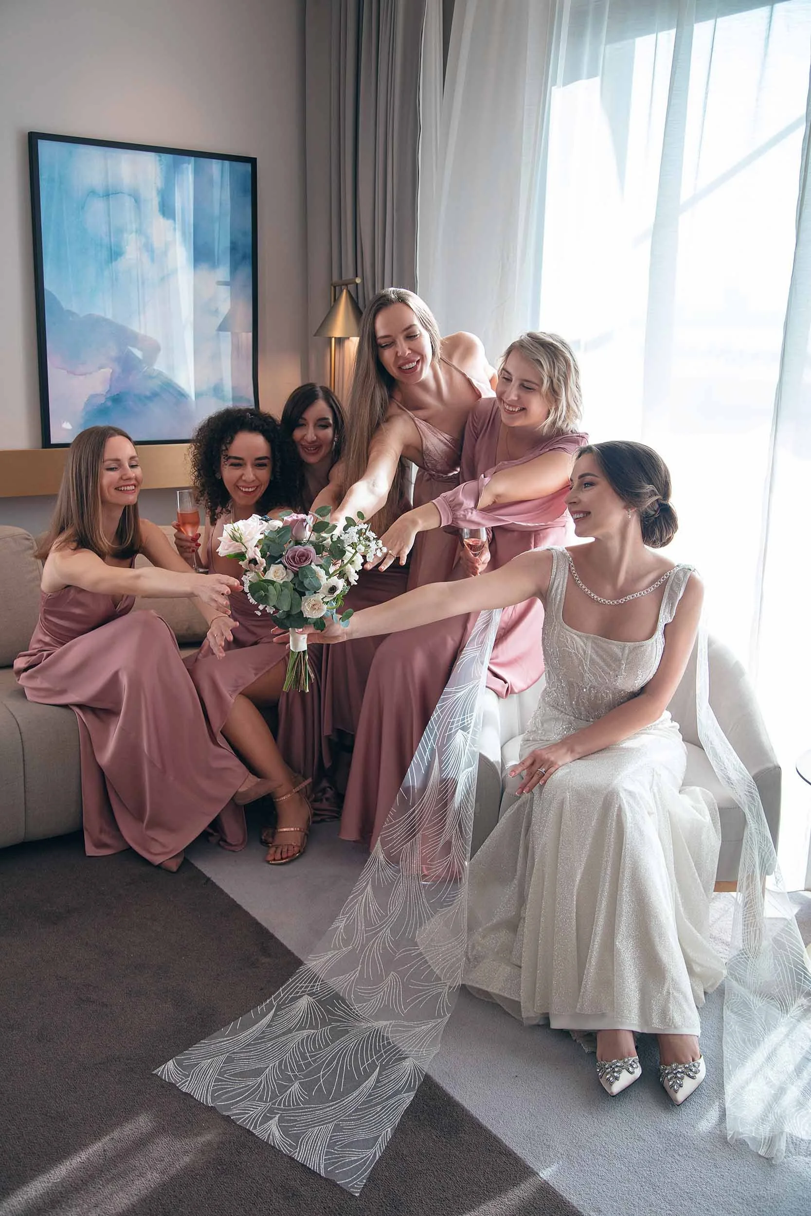 Bride with bridesmaids getting ready moments captured in Dubai wedding photography