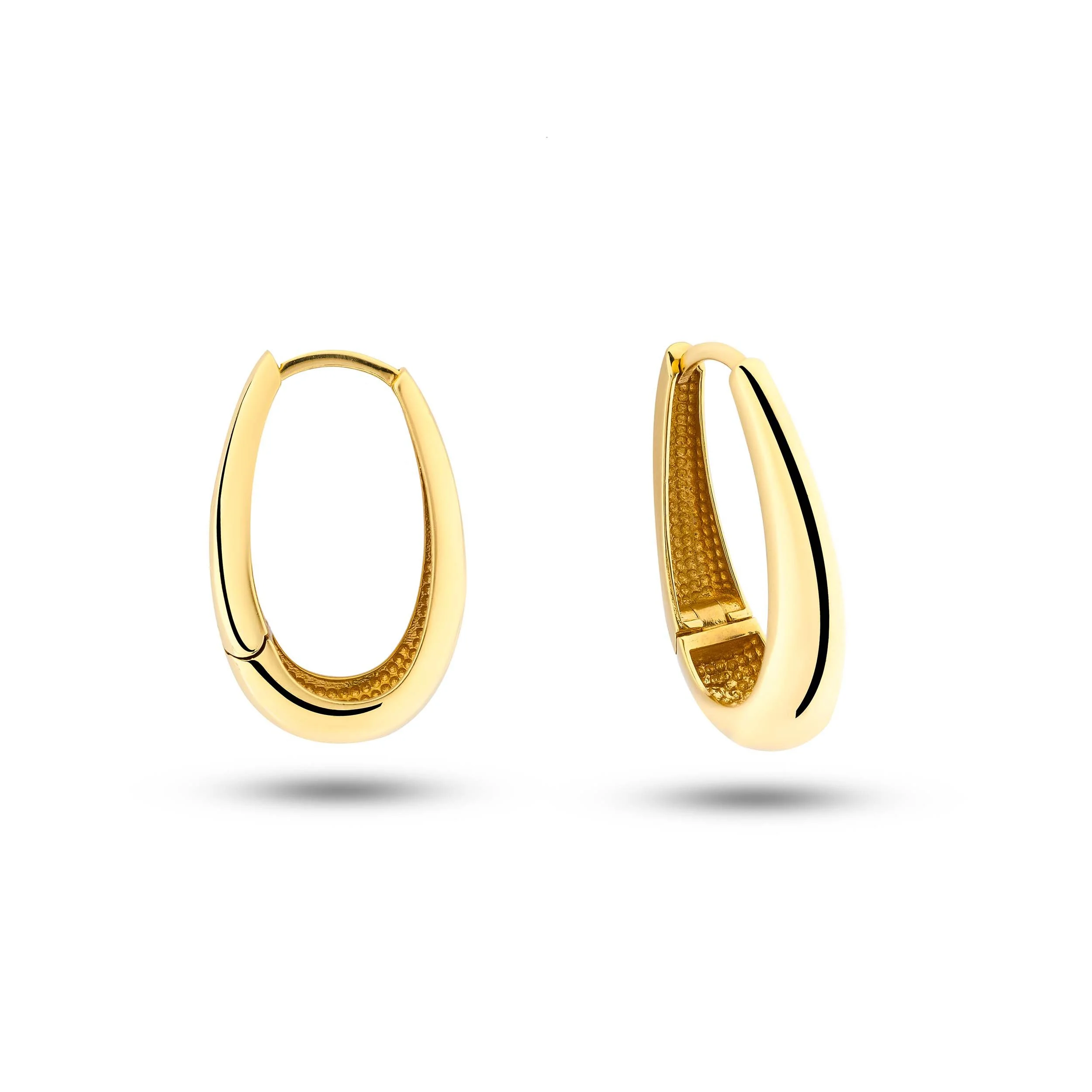 18K gold hoop earrings photographed for luxury jewellery photography in Dubai