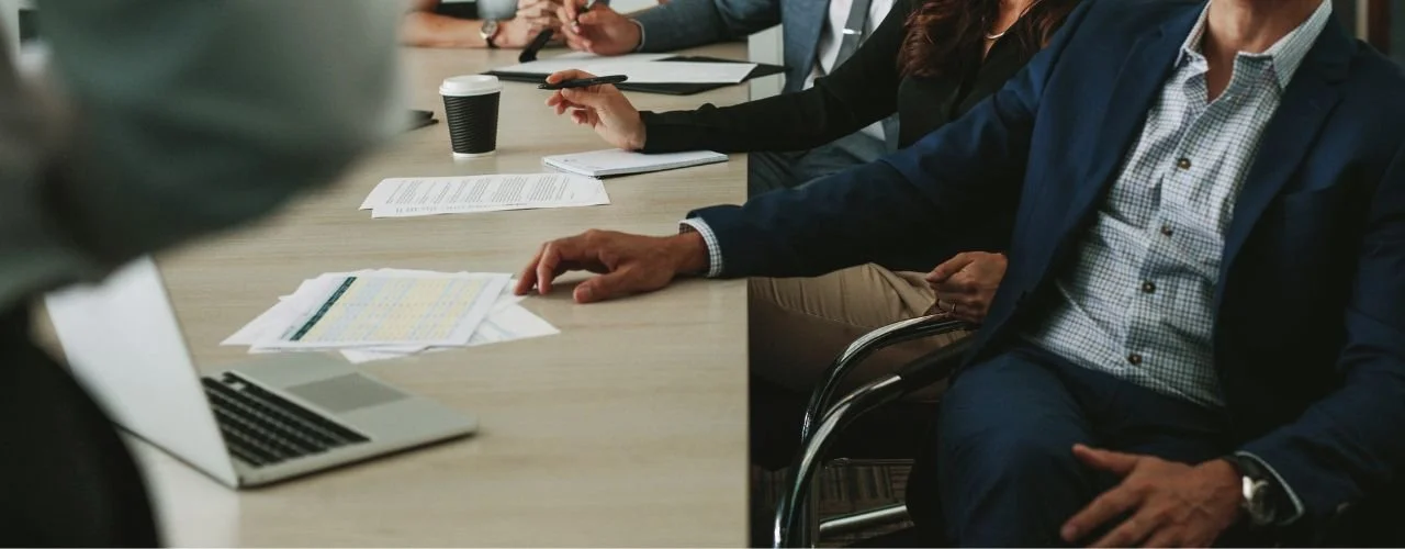 Pictured: executives in board room | The Cost of a Wrong C-Suite Hire (and How Executive Search Prevents It) | Suzie Walker Executive Search