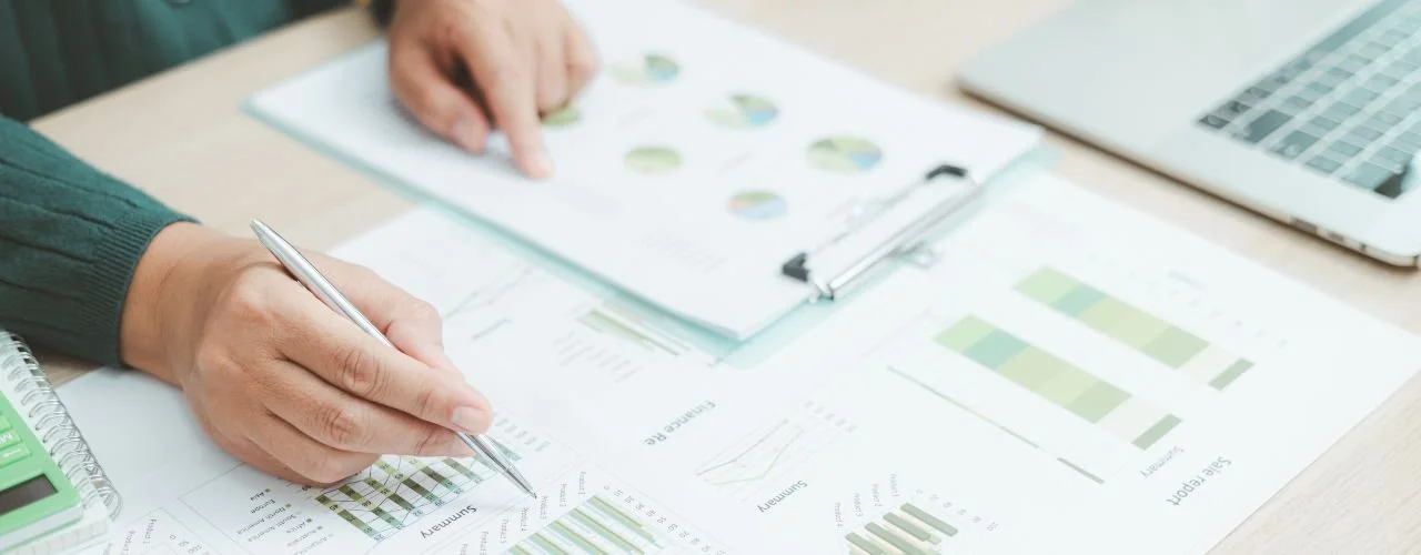 Pictured: senior marketing leader working at desk | Chief Marketing Officer vs Chief Growth Officer: Which Does Your Business Really Need? | Suzie Walker Executive Search