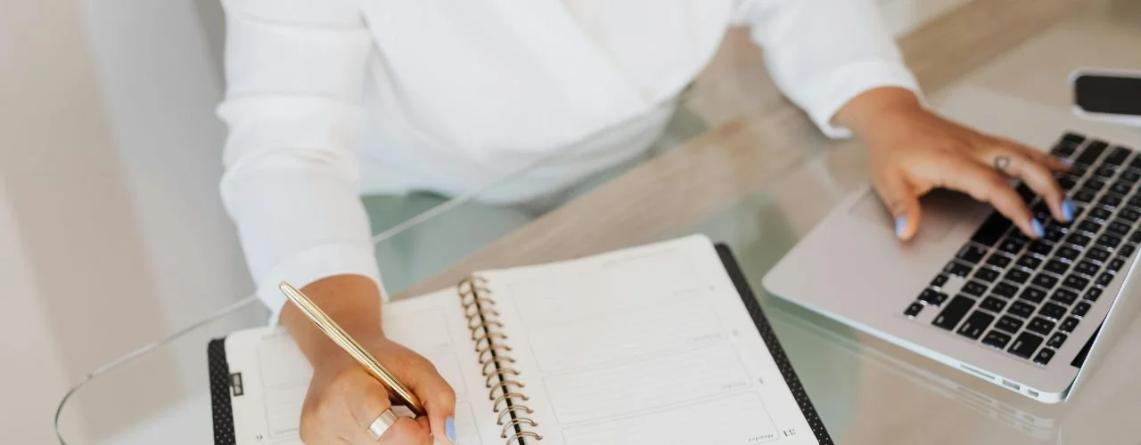 Pictured: Senior marketing leader working at desk | Top 5 Traits of Transformational Marketing Leaders | Suzie Walker Executive Search