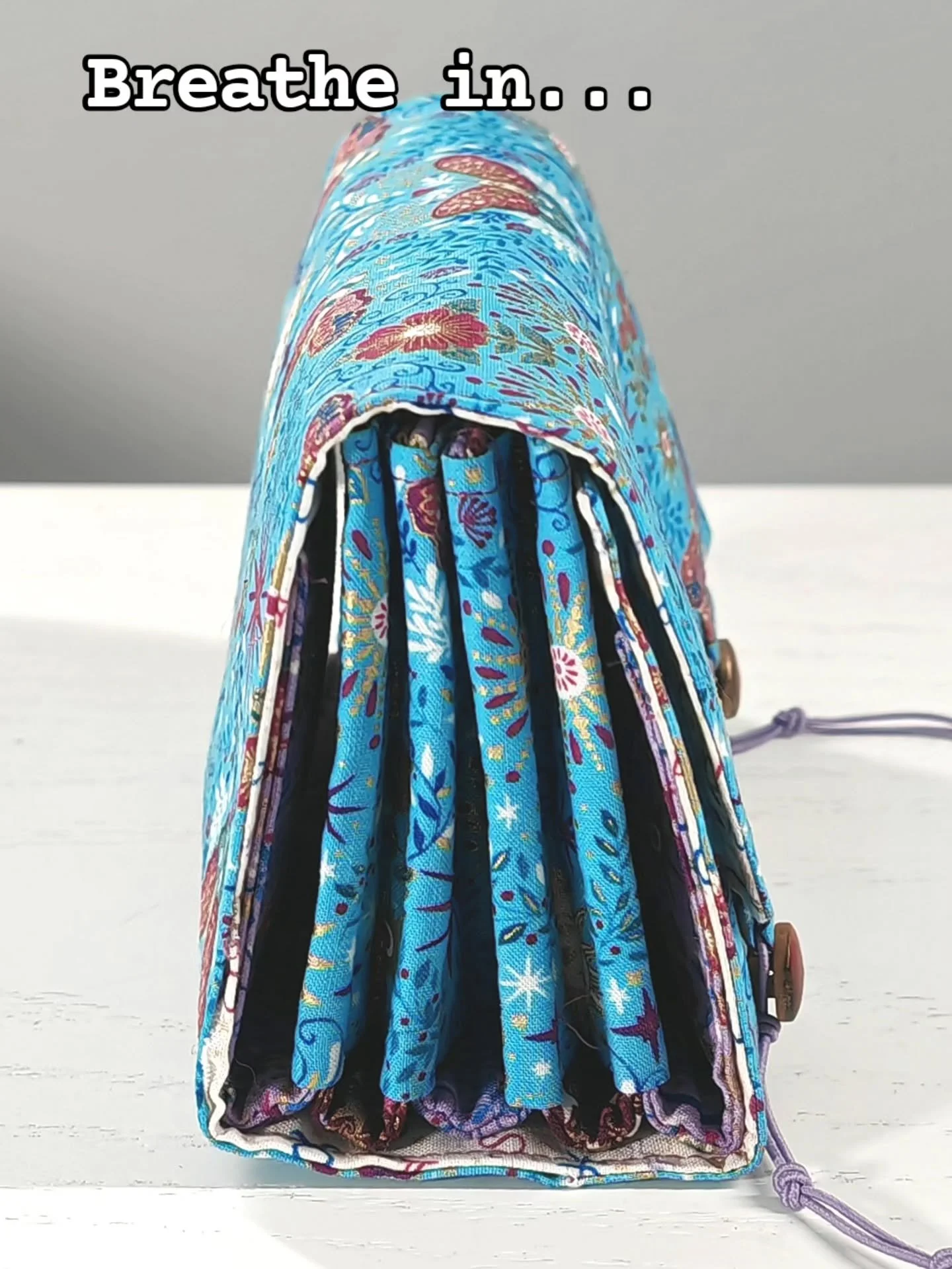 The Travel Buddy is an expanding organiser for you to sew, designed to hold all of your chargers and cables. It can expand by up to 3" thanks to an elasticated closure, so you can fit all of those extra chargers you need for a long holiday.

Thi