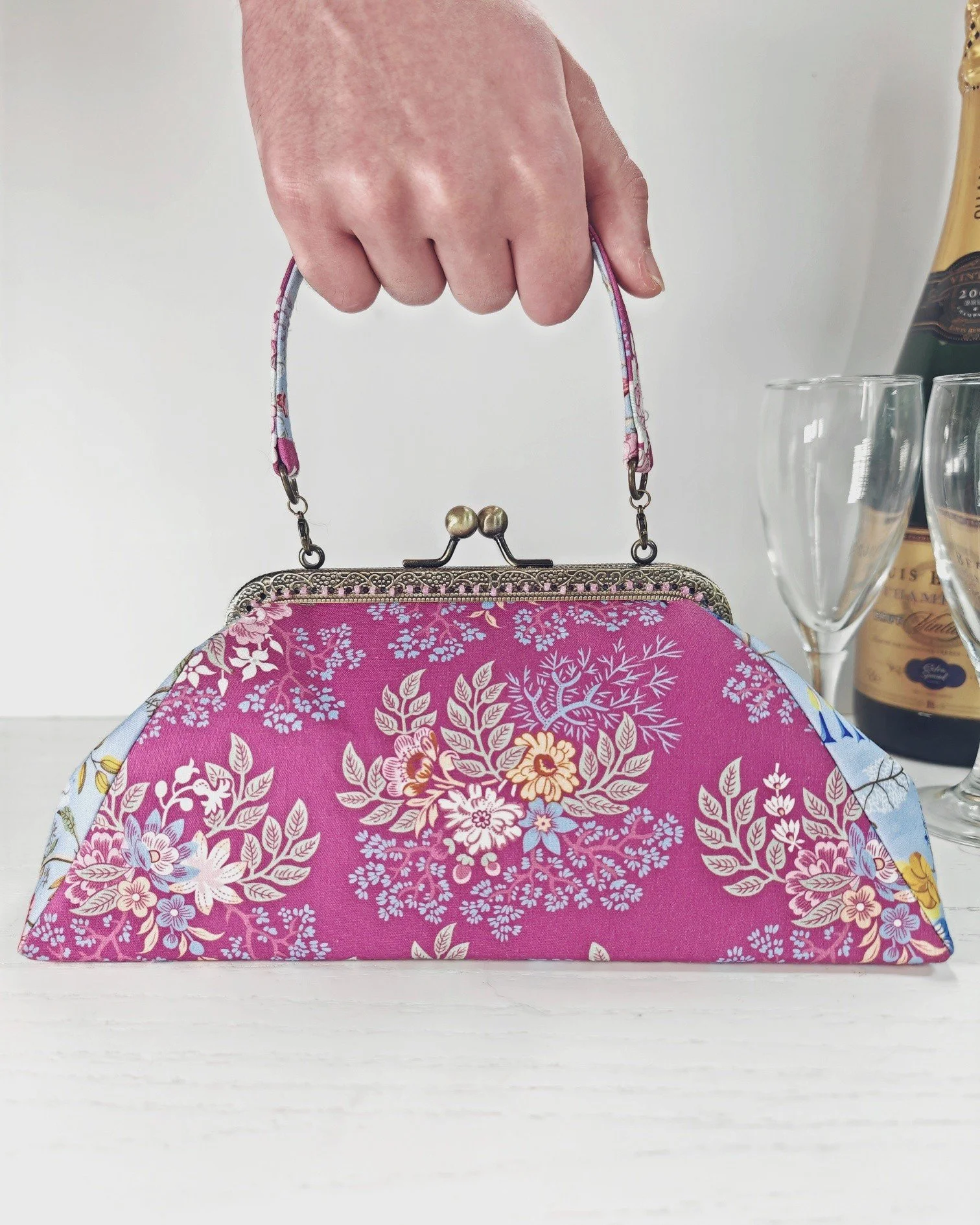 The Fabulous Fifties Frame Bag has had an update!

This delicate evening bag is surprisingly spacious, deep enough to hold your mobile, keys, and payment card. The sew-in purse frame is embellished with beads, and it has a narrow handle attached to t
