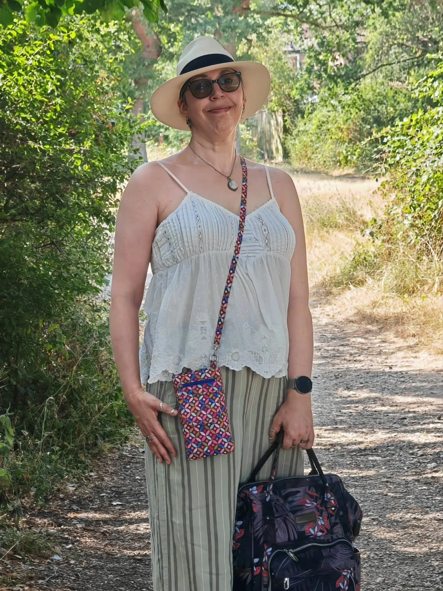 When I travel by train with my big backpack, I like to keep my phone and cards close to hand. I don't want to knock someone out swinging my backpack off of my shoulders!

The Everyday Travel Pouch is my go-to solution. It has all of the pockets! For 