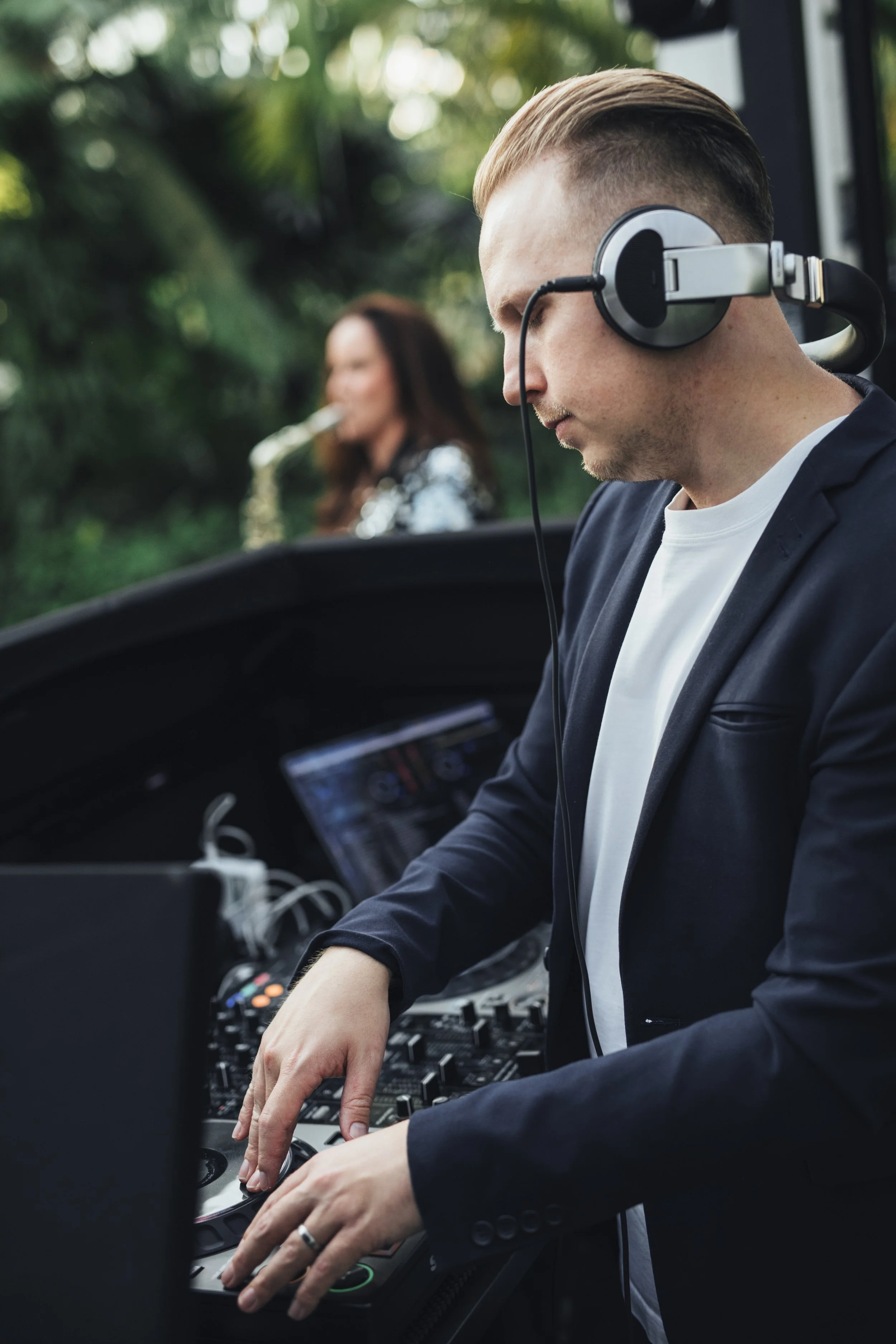 Essex corporate DJ performing live with saxophonist at a luxury outdoor corporate event