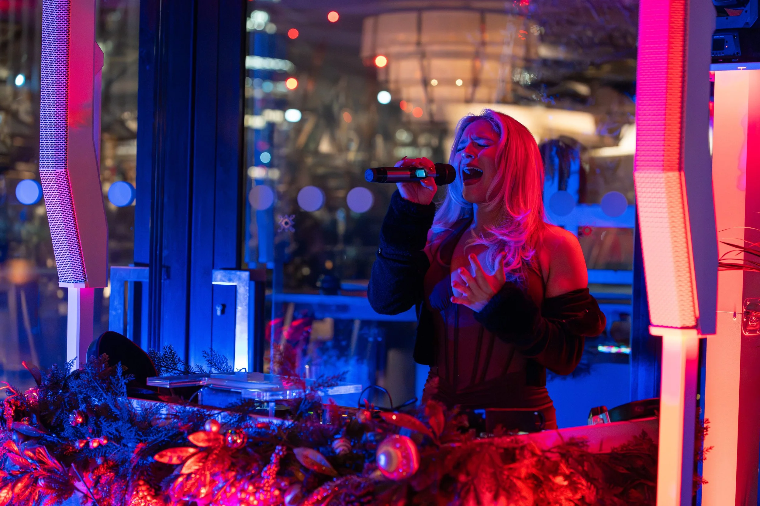 Live singer performing at an Essex corporate event with professional DJ entertainment