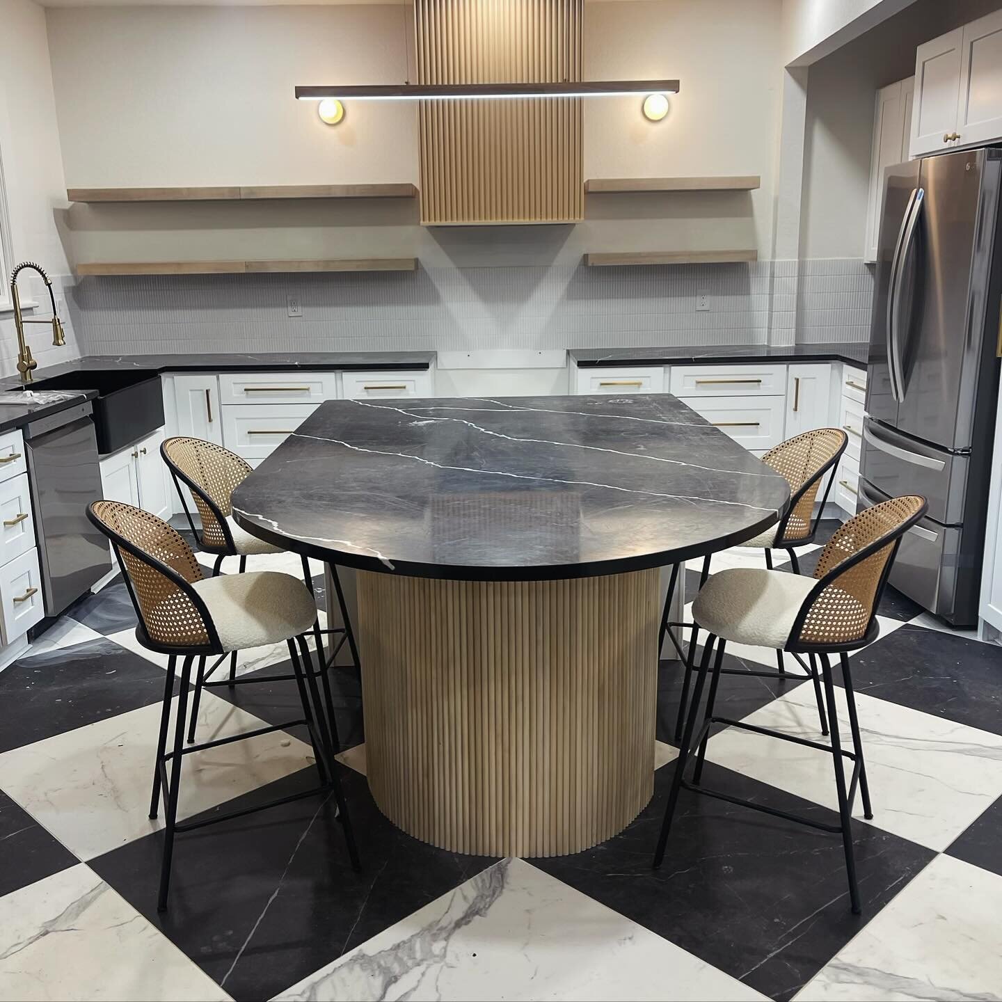 Making magic in the Deco District! Working alongside @the_airbnbnerd, we&rsquo;re thrilled to share the stunning progress on this client project. Check out this captivating kitchen with its black and white checkerboard marble flooring and a chic curv