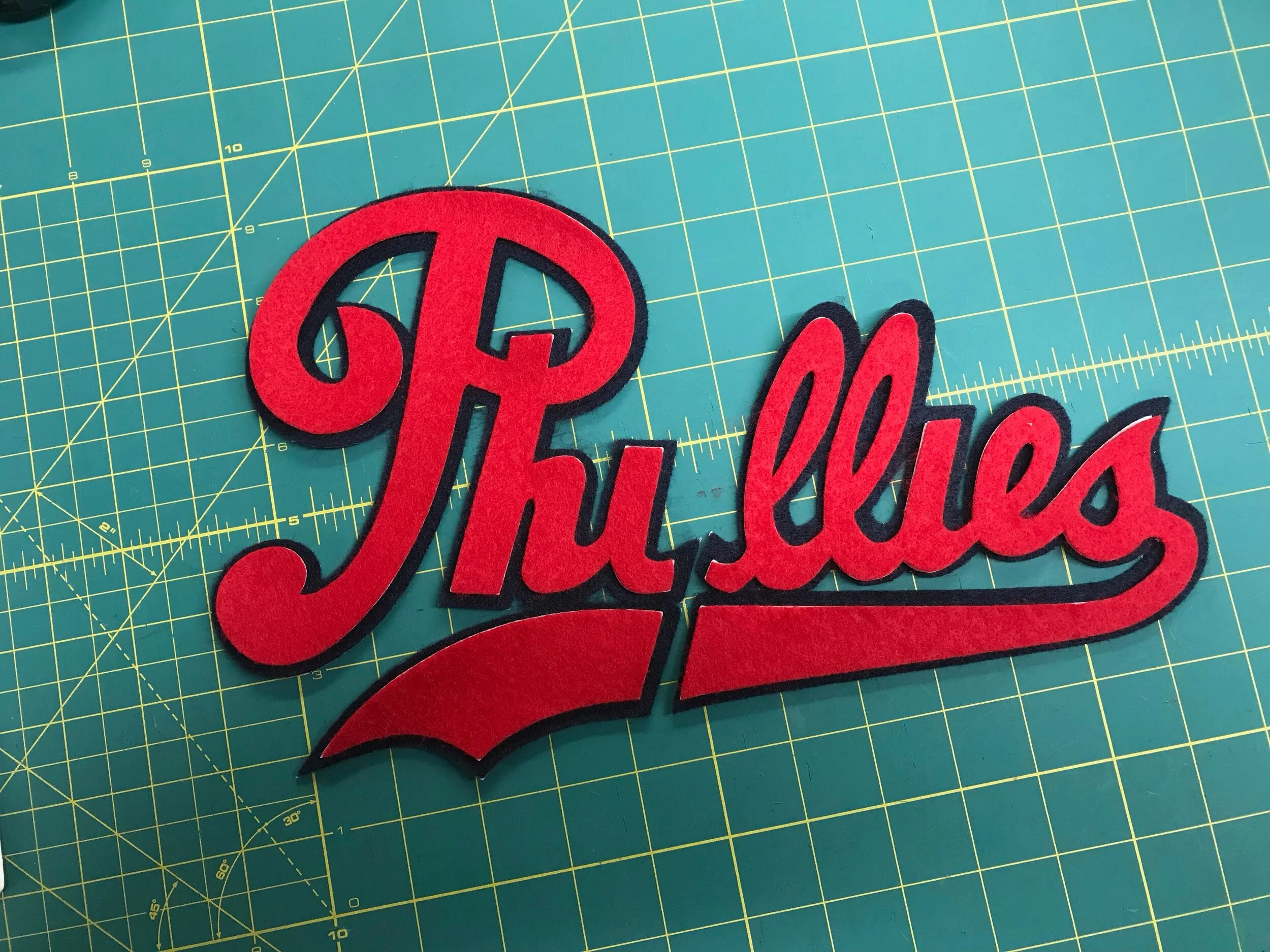 I carefully align the pieces, and will next press them together for eight seconds at 330º F. The backing on the top layer bonds it to the bottom layer to prepare it for stitching.