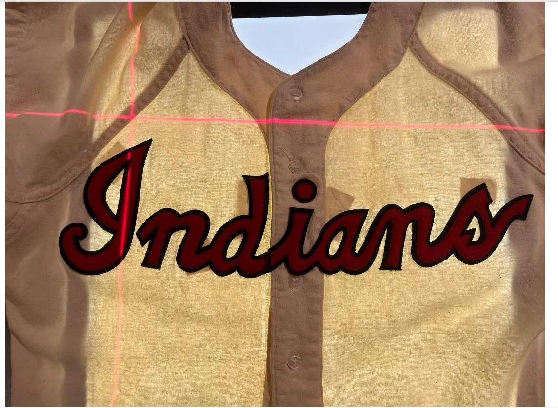 Now that the felt has been cut and the two layers stitched together, I overlaid the belt onto the jersey and was pleased to see that all of the ghosts and tiny holes that I had highlighted were perfectly matched by the new Indians crest that would so