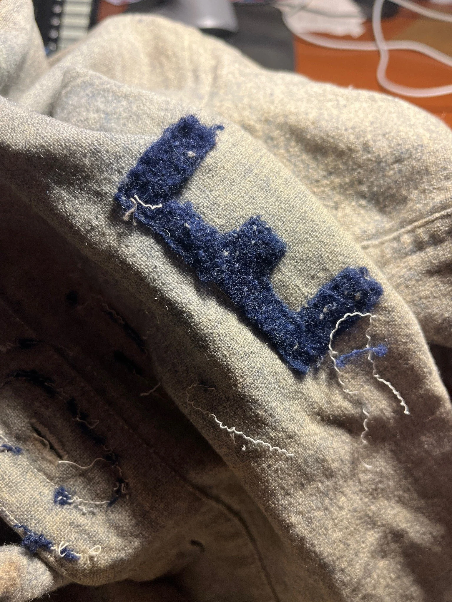 With the owner’s permission we carefully removed the front KEEFERS STORE lettering one tiny stitch at a time to lift it away from the jersey. And when we did, look what we found…