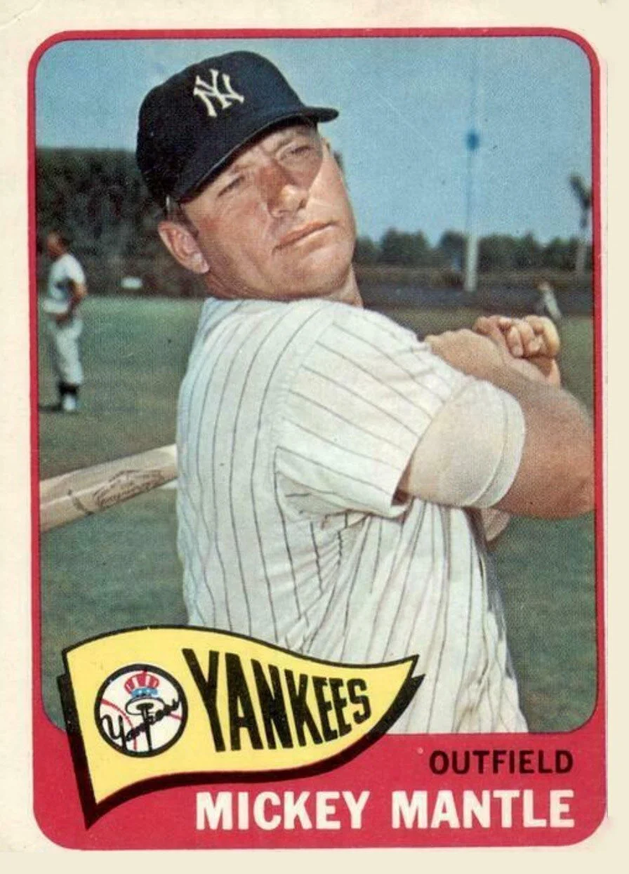 Mantle is also wearing the jersey in the photo on this 1965 card, taken in 1965 spring training. There is a positive match to the way the stripes align in the underarm gusset and the exact location of the vent holes.