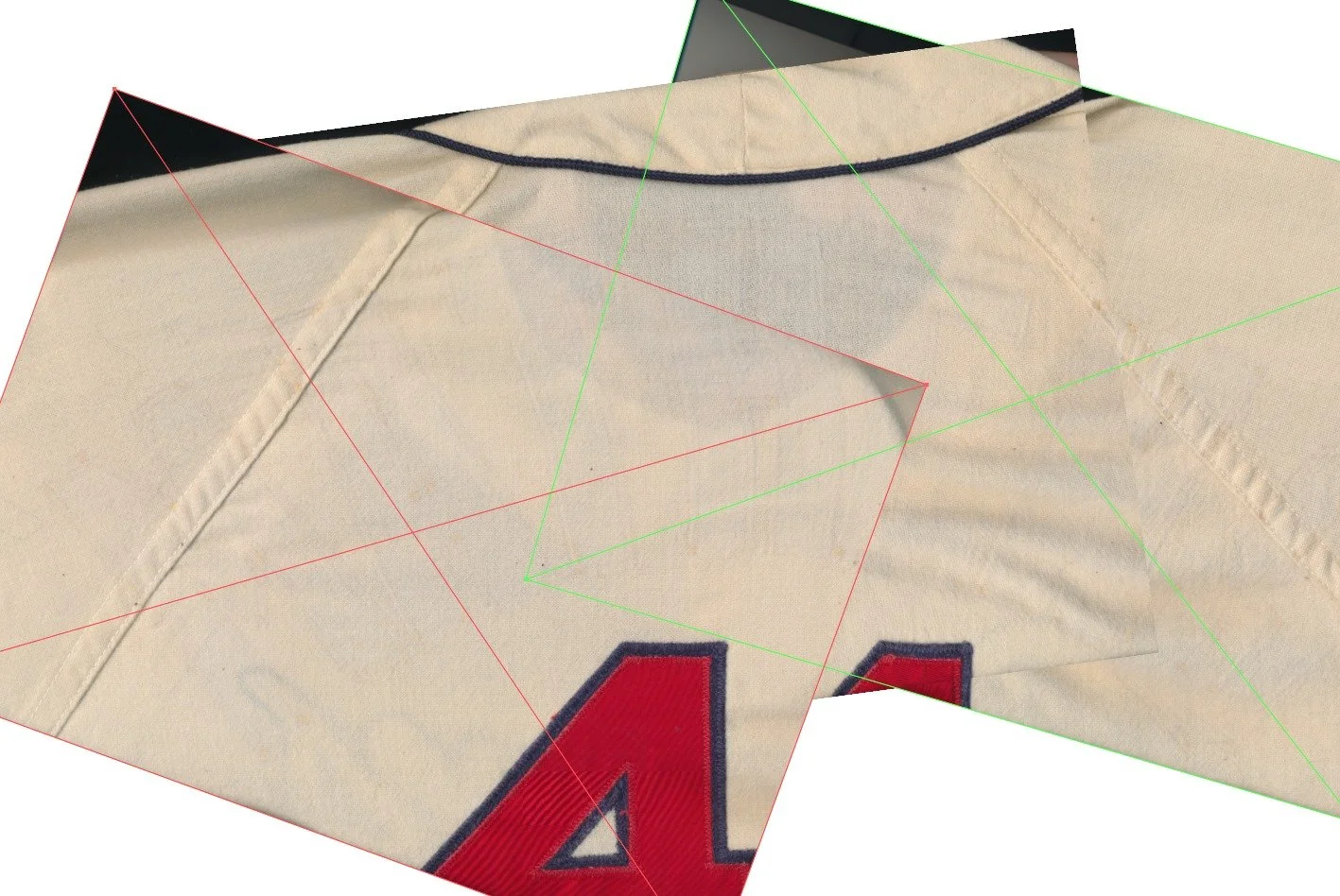 The first thing I do is put the jersey on the flatbed scanner and scan it in high resolution. This does two things for me. First, I can zoom in and see every tiny detail of where the old stitching was removed. Sewing fabric compresses the weave of th