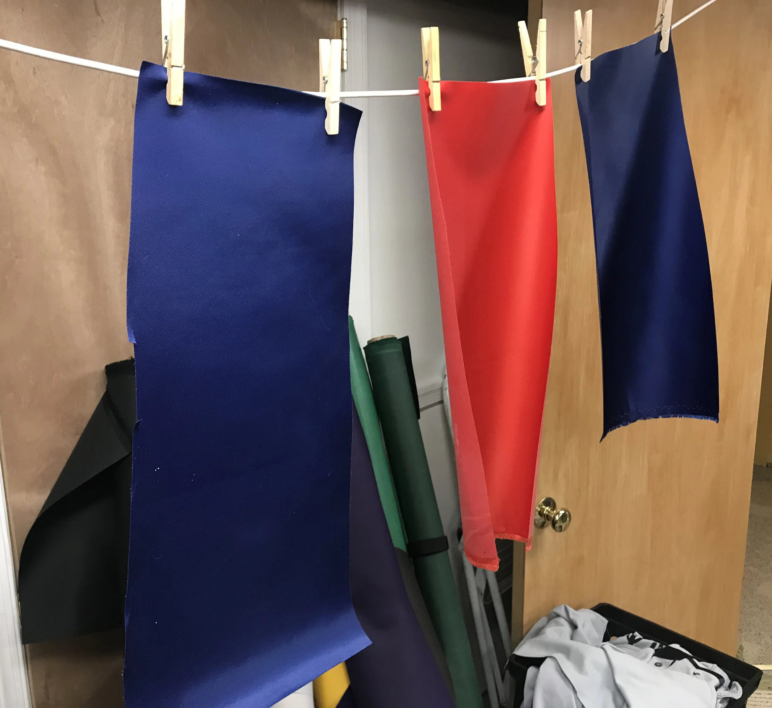 After sandblasting, we wash and dry the fabric, then dye it to change the shade slightly (if needed.) Notice how I prepared two different shades of blue -- I will choose the one that more closely matches the original, aged lettering, once these have 