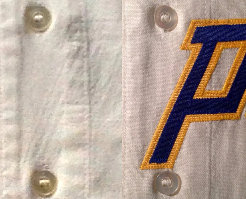 Ghosts of the original wordmark were still visible. These ghosts are caused by the way the sewing thread bunches the fabric below, making it harder for light to pass through.