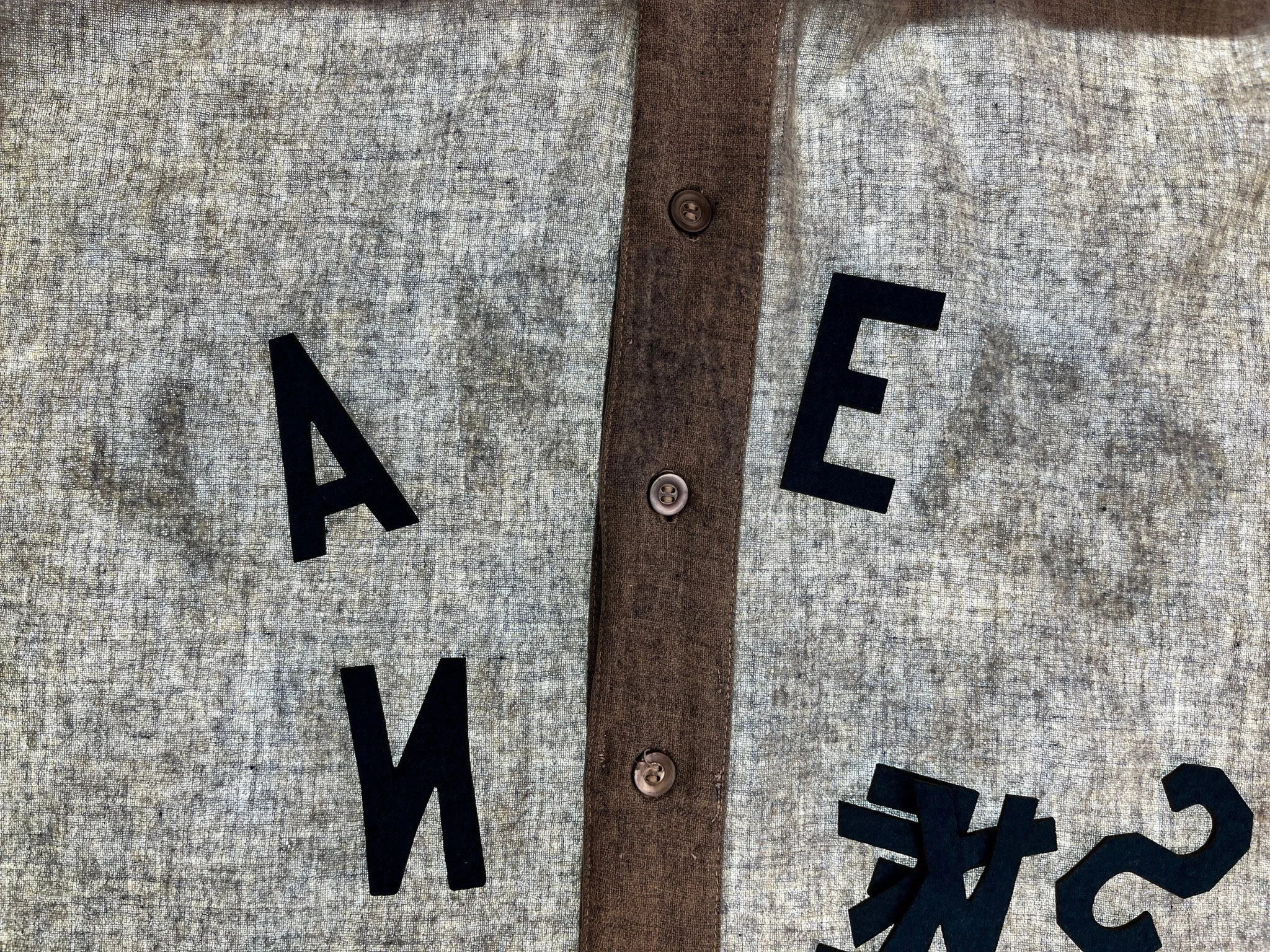 The laser cutter makes quick work of the felt, precisely cutting the vector-images into perfect matching lettering, though it smells like burning hair— because that’s precisely what wool felt is (sheep hair!)