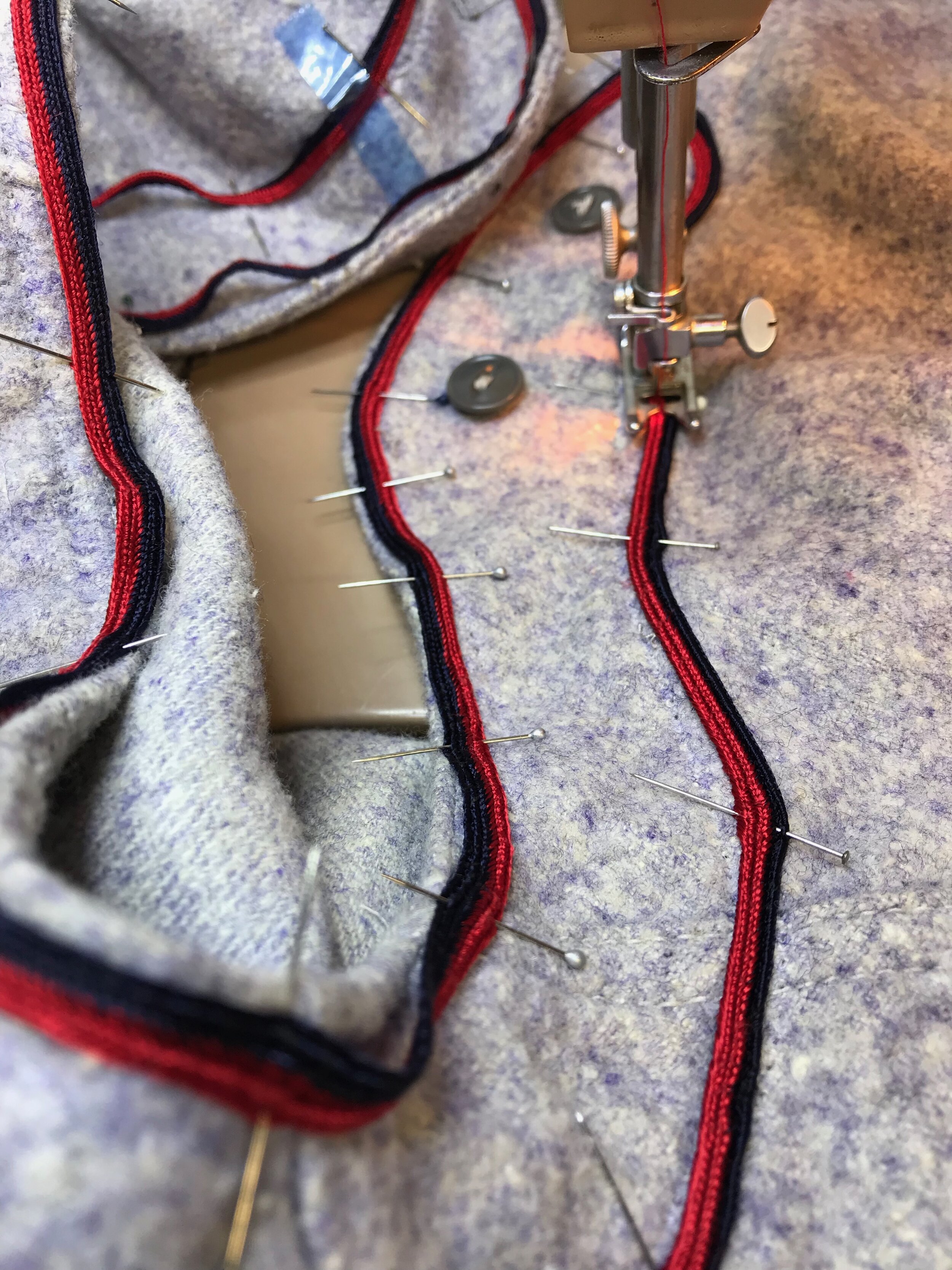 Next, we must resew the revised trim.  I used dozens of pins, adjusting them several times before starting to sew.