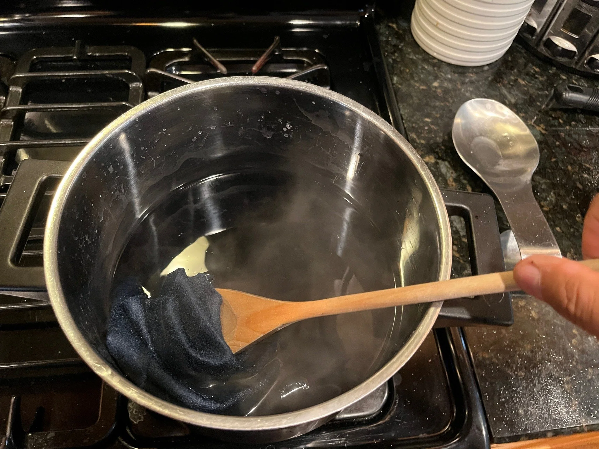 The felt fabric needs to be aged to make it match the jersey it will be sewn on. Bleach is too strong; using it makes felt fall apart! The answer is a strong solution of Carbonna, an old time washday product from the 1930s used to remove stains from 