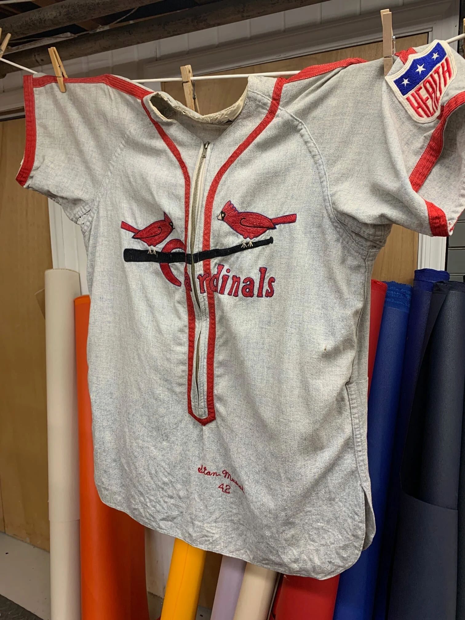 I have learned that many of these antique jerseys are terrifically dirty. I suggested hand-washing the jersey to even the tone and brighten it. When it had dried, it was much brighter all over!
