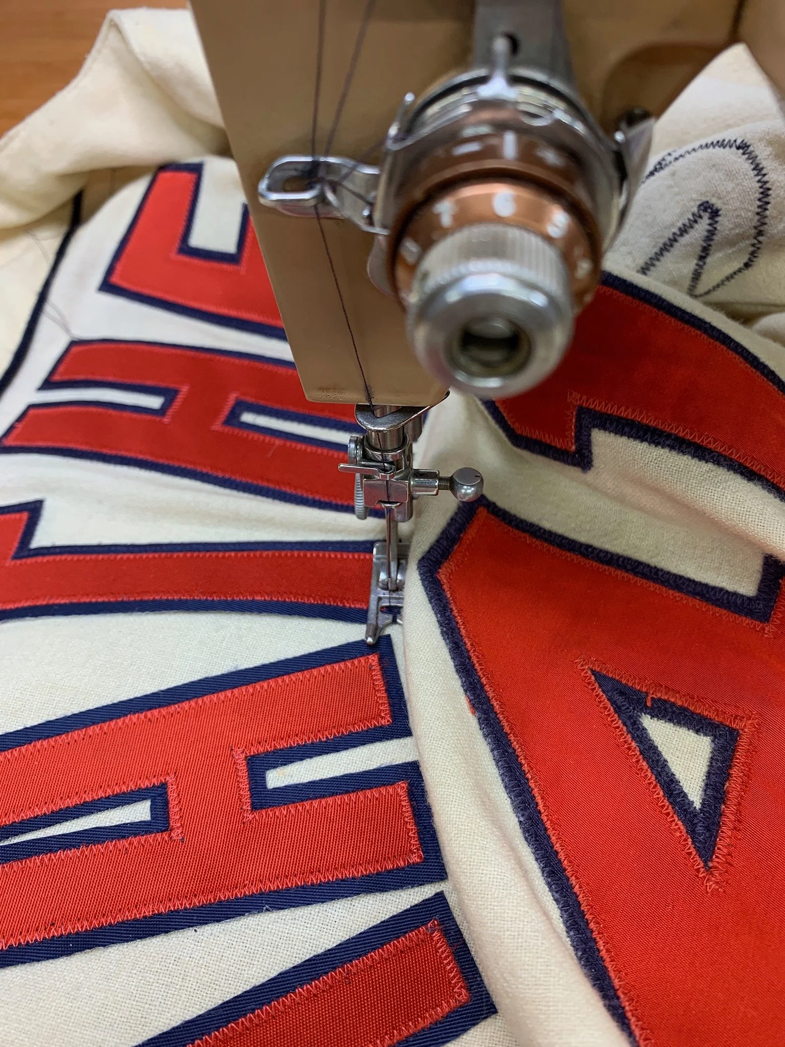 Here, the lettering being stitched in place on my 1957 vintage Singer Slant-o-Matic sewing machine.