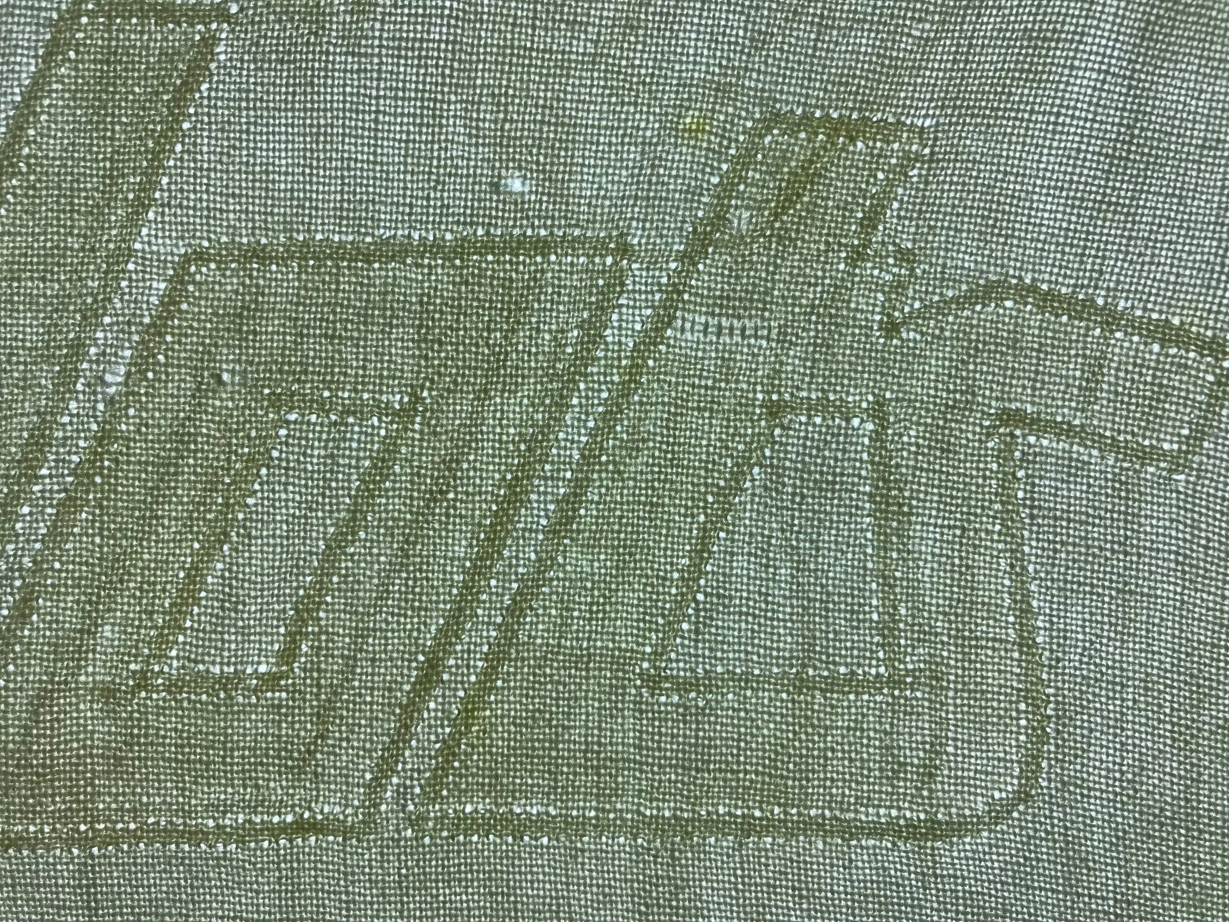 Look closely at this light table view, and you will be able to see ghosts of the original wordmark, faintly still existent even after 51 years, behind the darker shadow of the newer wordmark that I just removed. The shadows are caused by the original