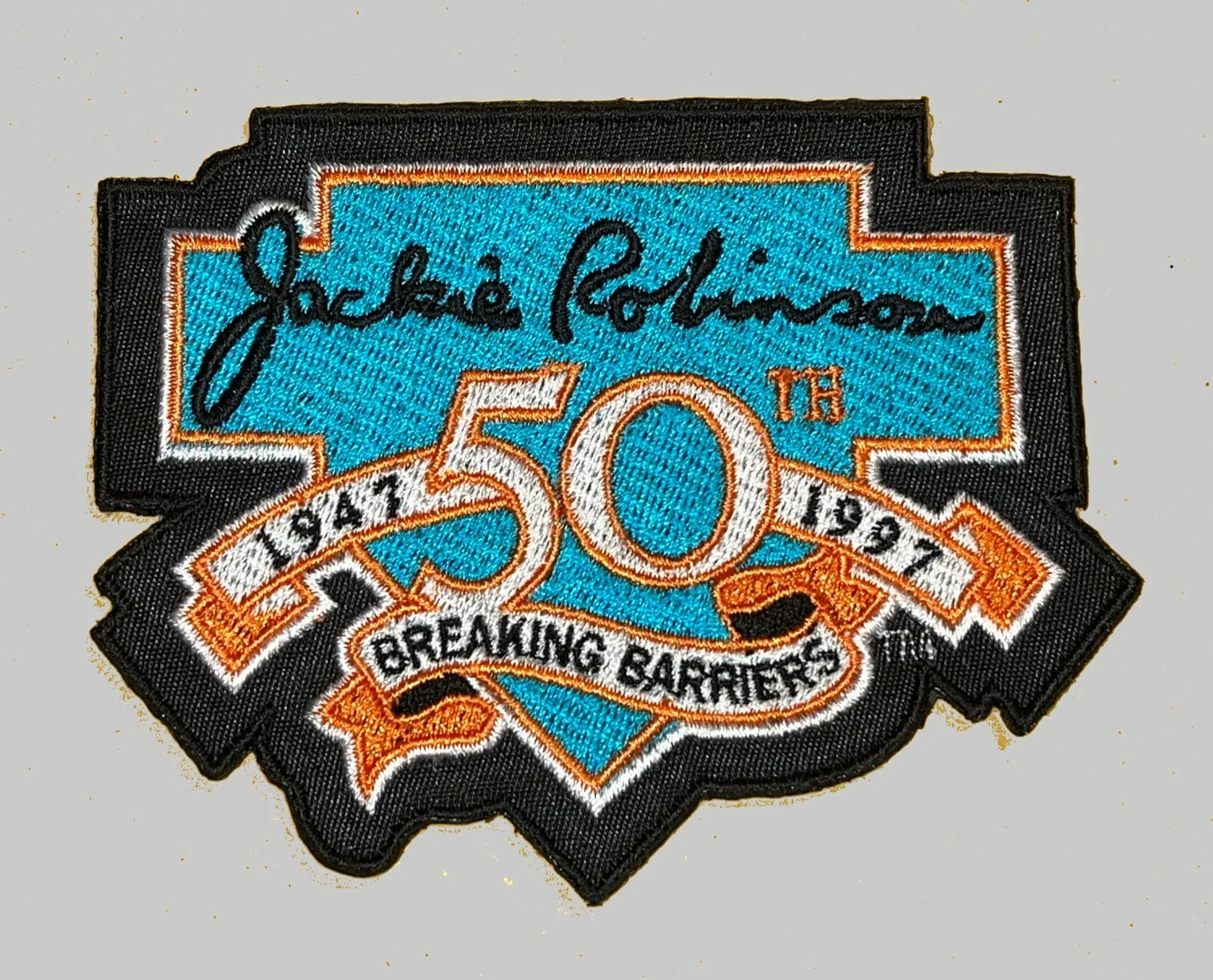 The impossible to find 1997 Marlins-only Jackie patch, from the year the Marlins won the World Series. These patches were stripped off before the jerseys were sold.