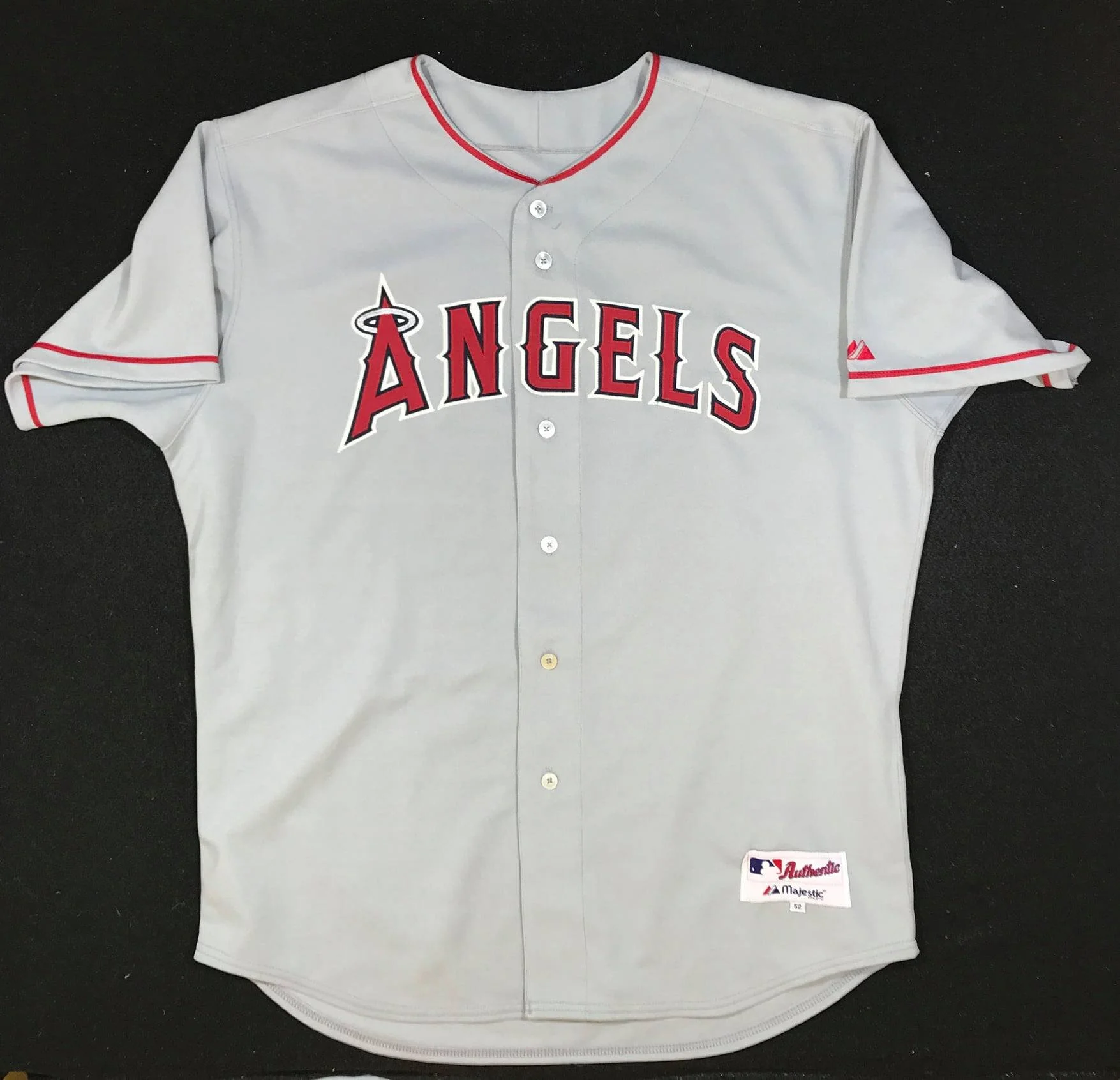 Our starting point is a blank Angels jersey to be stripped of all lettering, patches and trim. Not a small task, and a significant amount of the work involved in the job.
