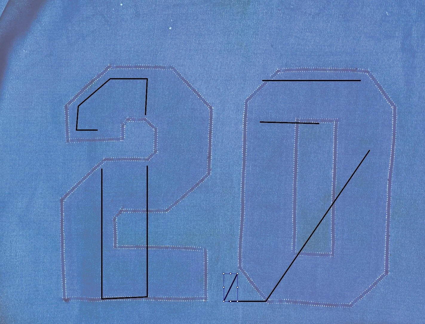 Next we turned to the player numbers. Notice that the “0” in the 20 does not match the team pattern for road jerseys. It’s likely they used numbers taken off another uniform. Once the old numbers were removed, the ghosts of the prior “17” became more