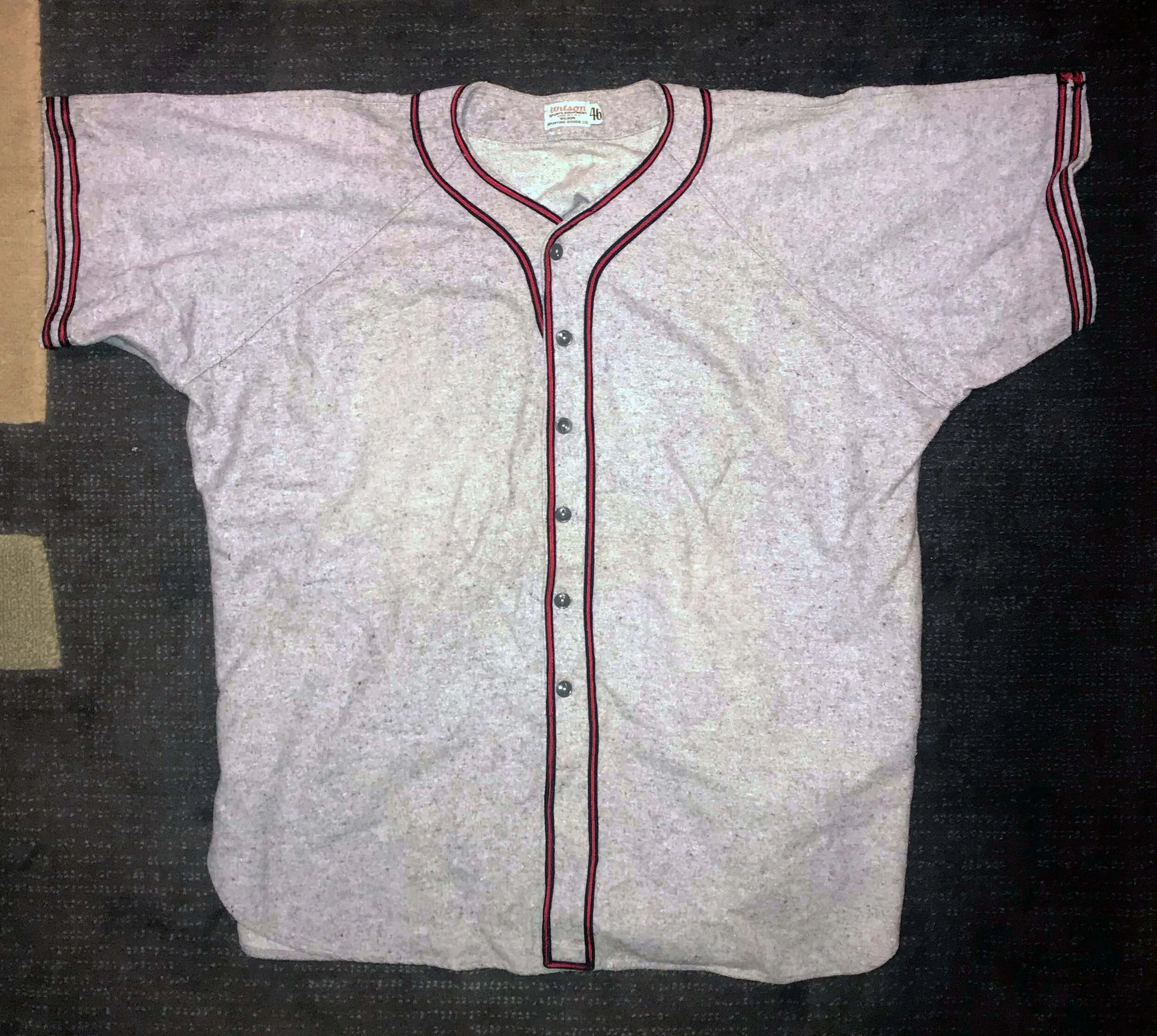 This Wilson heavyweight flannel, purchased on Ebay, has been properly stored since it was made (I am guessing early 1940s).

Notice that the ribbon trim -- while the correct colors -- has three color bands (it should have two) and the sleeves has two