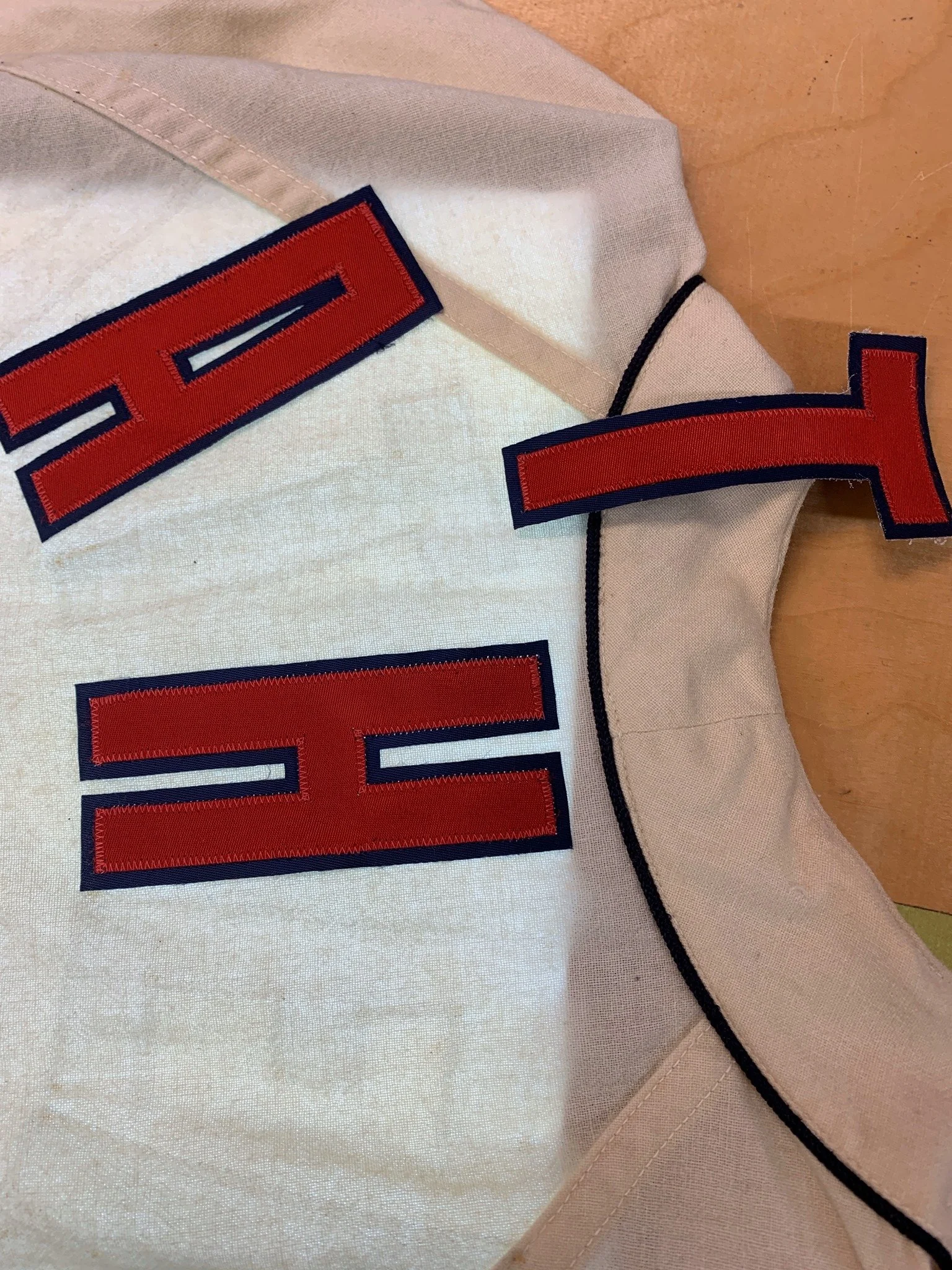 The placement of the new lettering is done on the light table. My goal is to exactly cover the original shadows so that zero evidence remains of the letters having gone missing.